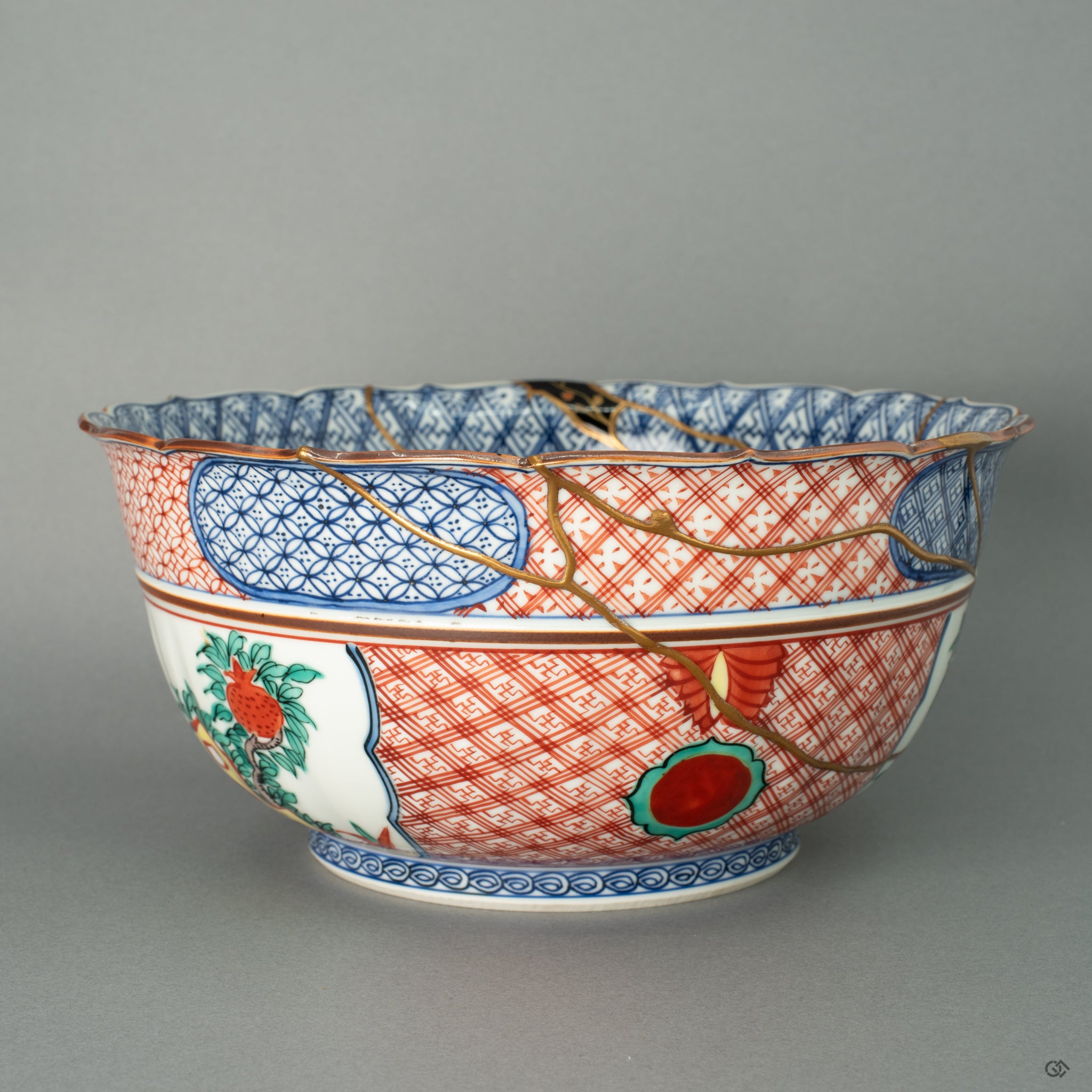 A close-up on a large, dramatically repaired section, where a wide expanse of 24k gold, enriched with platinum and silver Maki-e, forms a new, luminous landscape. This lavish application of precious metals doesn't hide the damage but transforms it into the most celebrated feature of the vessel.