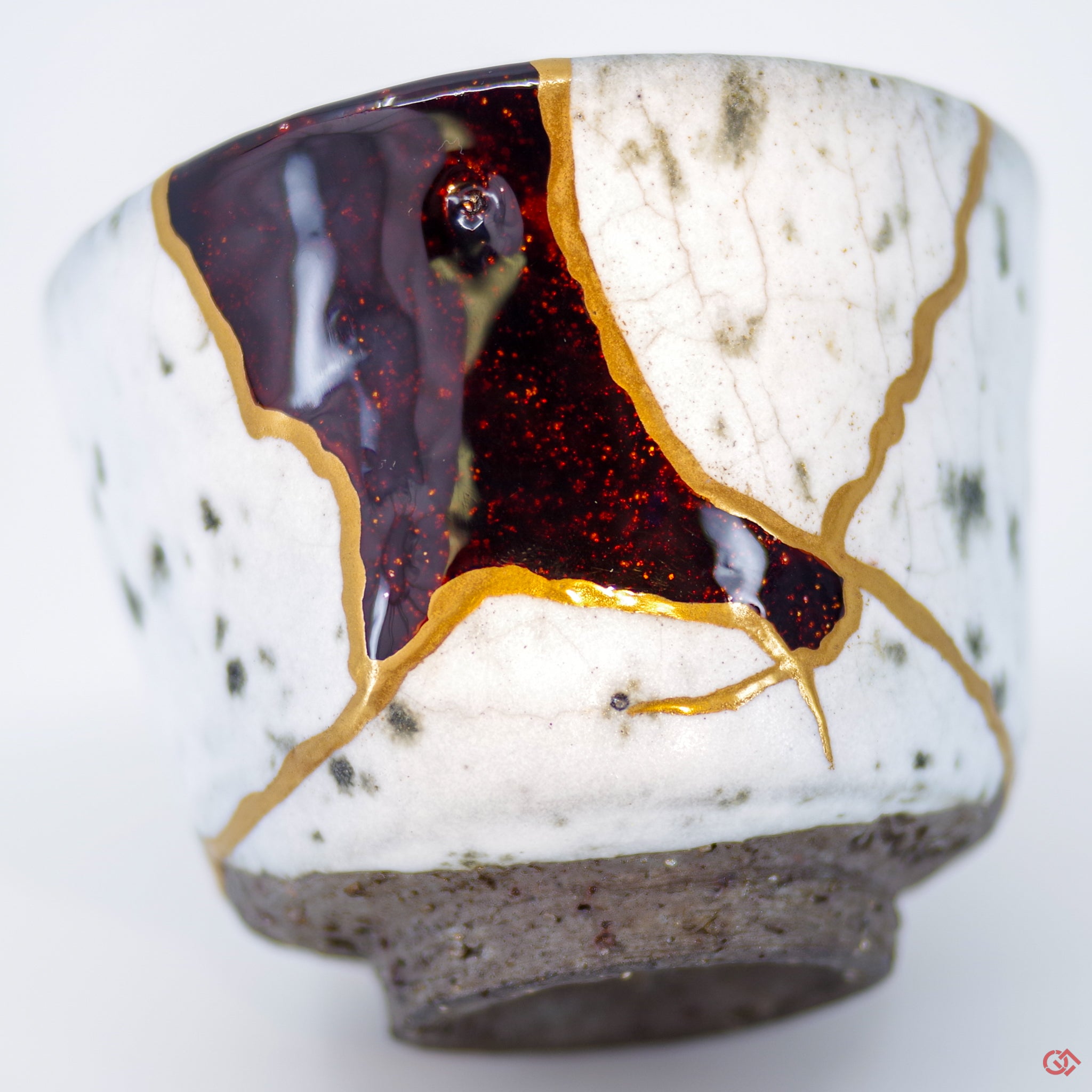 Close-up photo of an authentic Kintsugi pottery piece, showing the detail of its repairs and craftsmanship