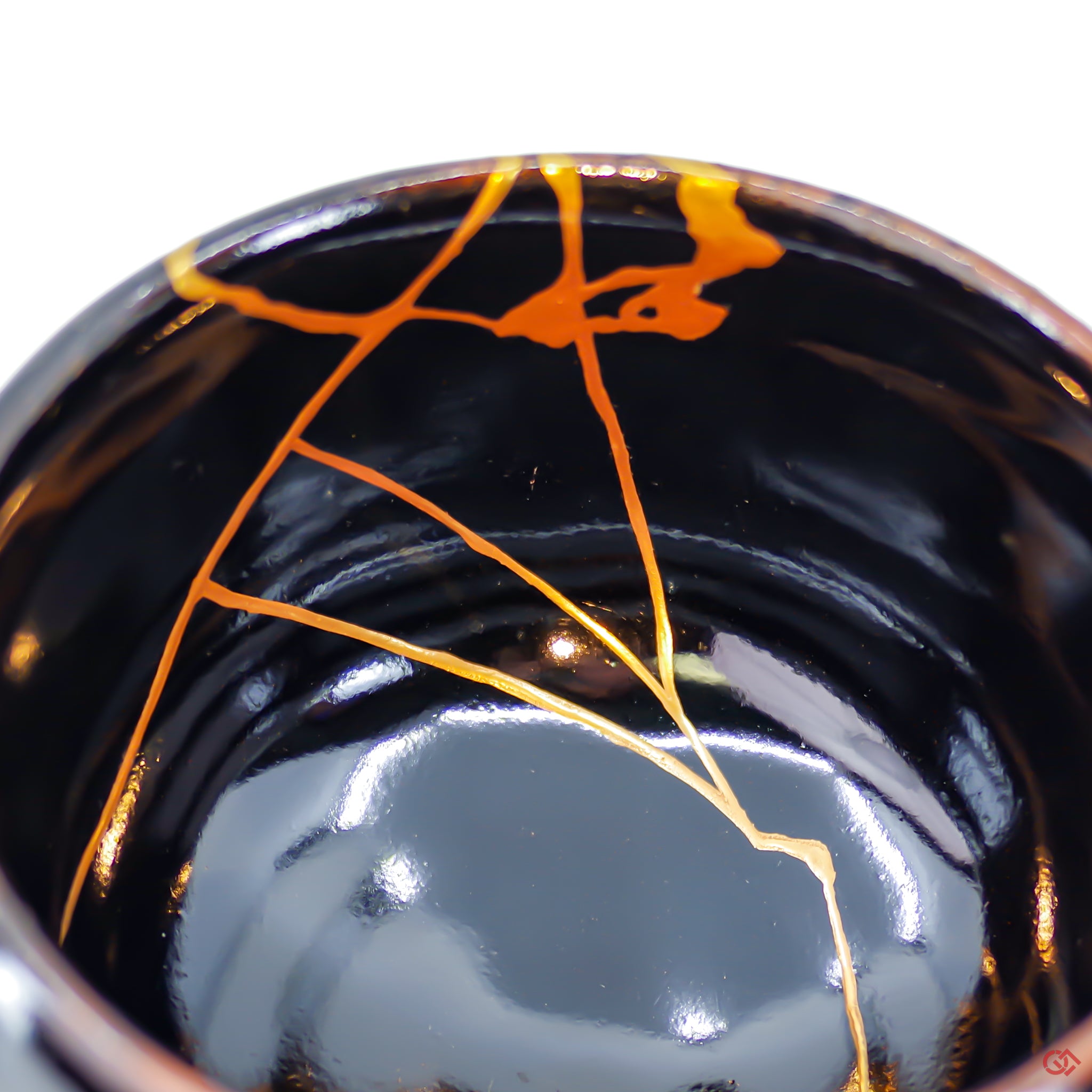 Close-up photo of an authentic Kintsugi pottery piece, showing the detail of its repairs and craftsmanship