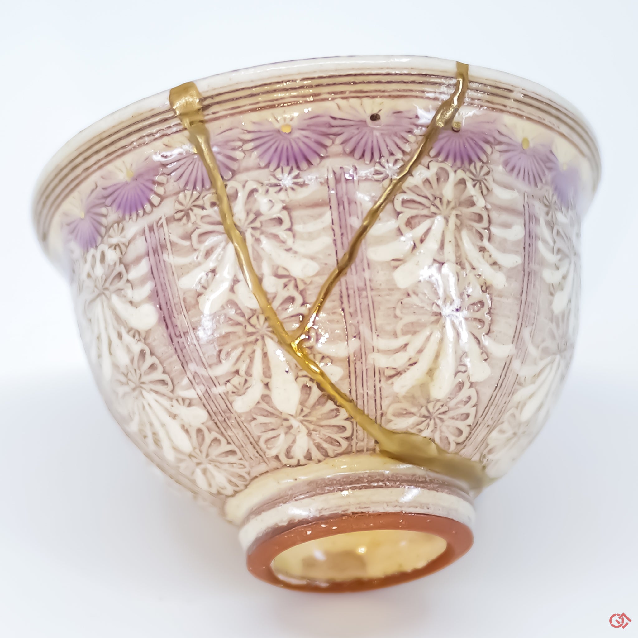 Close-up photo of an authentic Kintsugi pottery piece, showing the detail of its repairs and craftsmanship