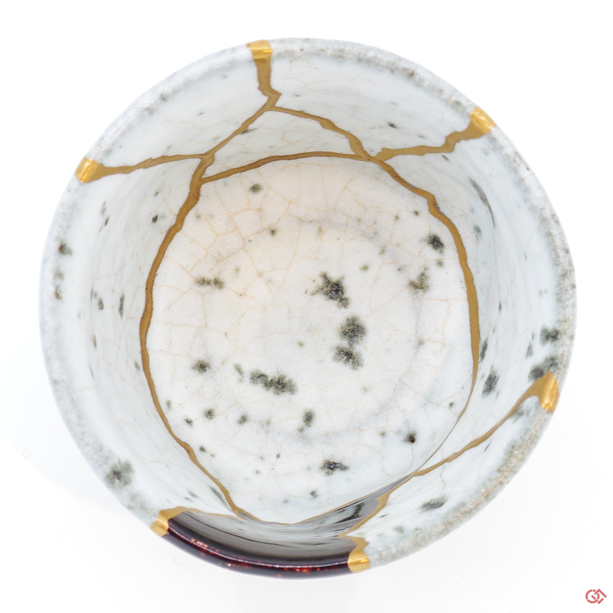 Photo of the top side of an authentic Kintsugi pottery piece, showing its overall design and features