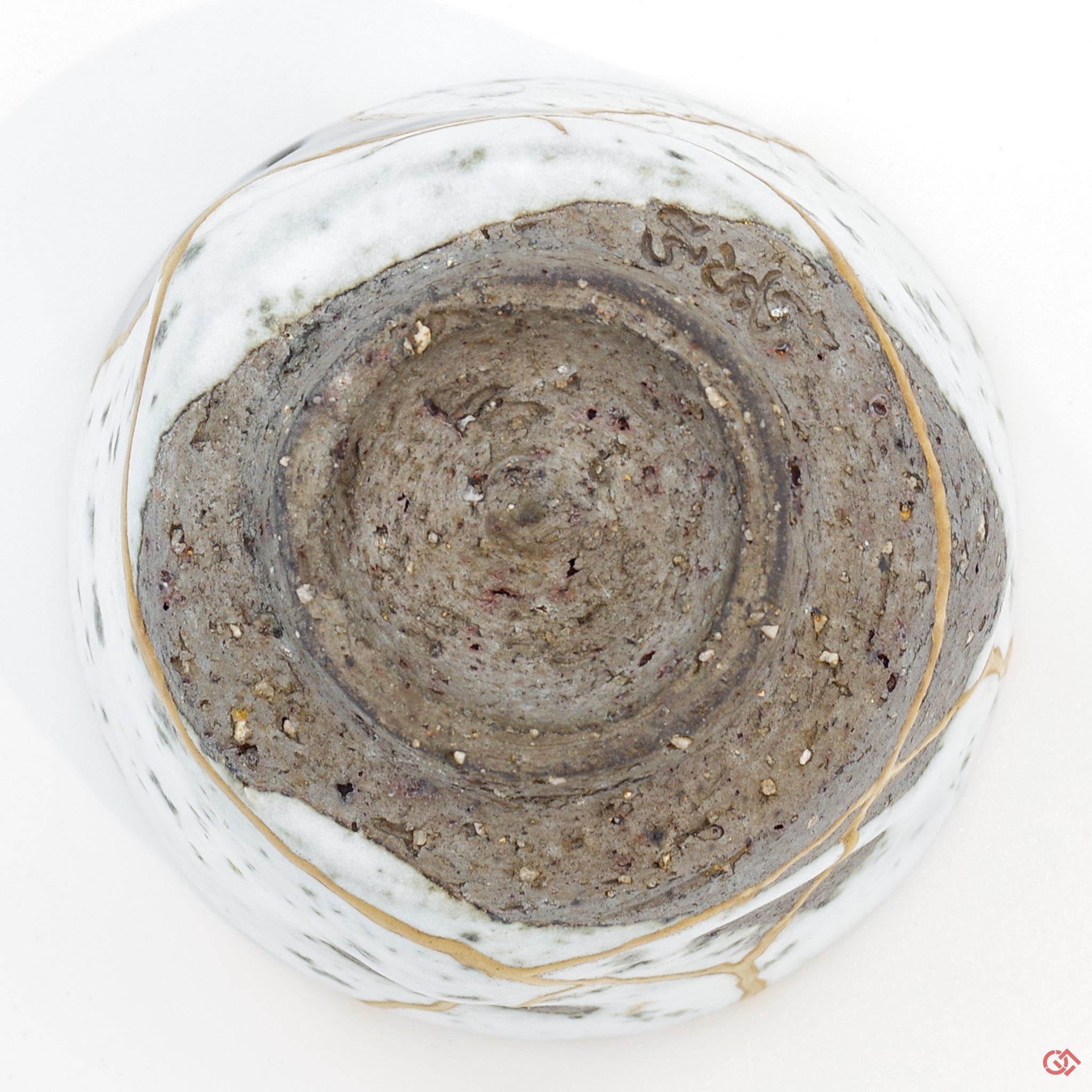 Photo of the bottom side of an authentic Kintsugi pottery piece, showing its overall design and features