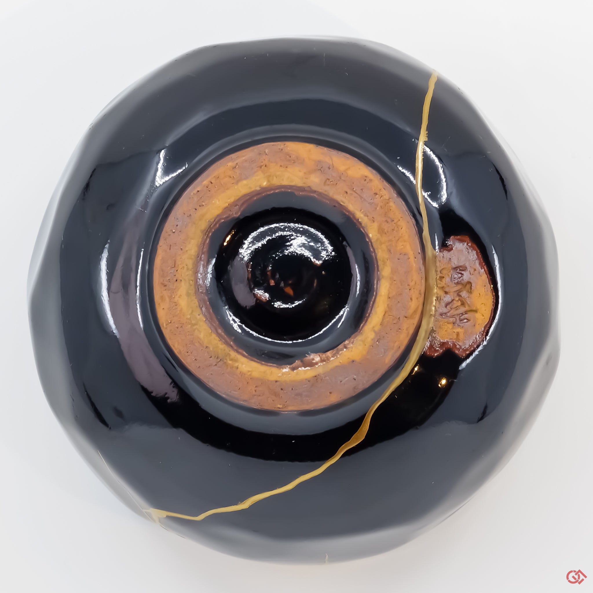 Photo of the bottom side of an authentic Kintsugi pottery piece, showing its overall design and features
