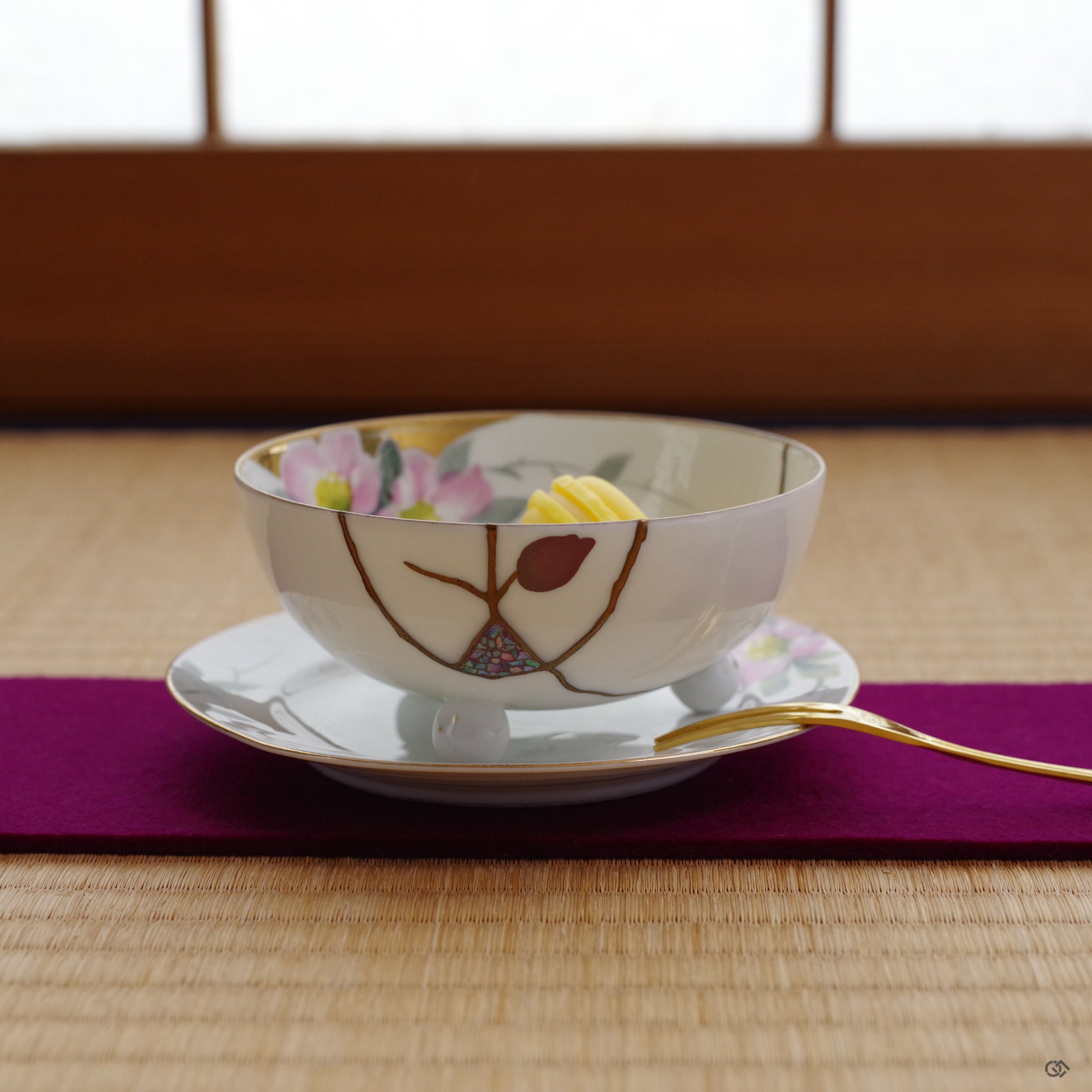 The restored Noritake kintsugi confectionery cup and saucer held in hand, its purpose renewed as a mindful object for the practice of intentional living.