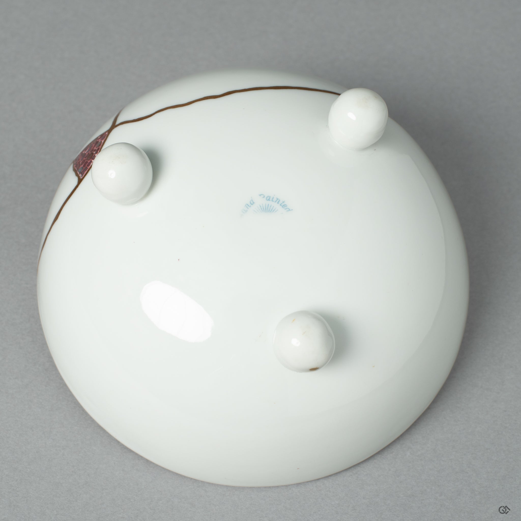 The maker's mark on the base of the restored Noritake cup, a signature of heritage and authentic Japanese craftsmanship' honored by the artist's work.