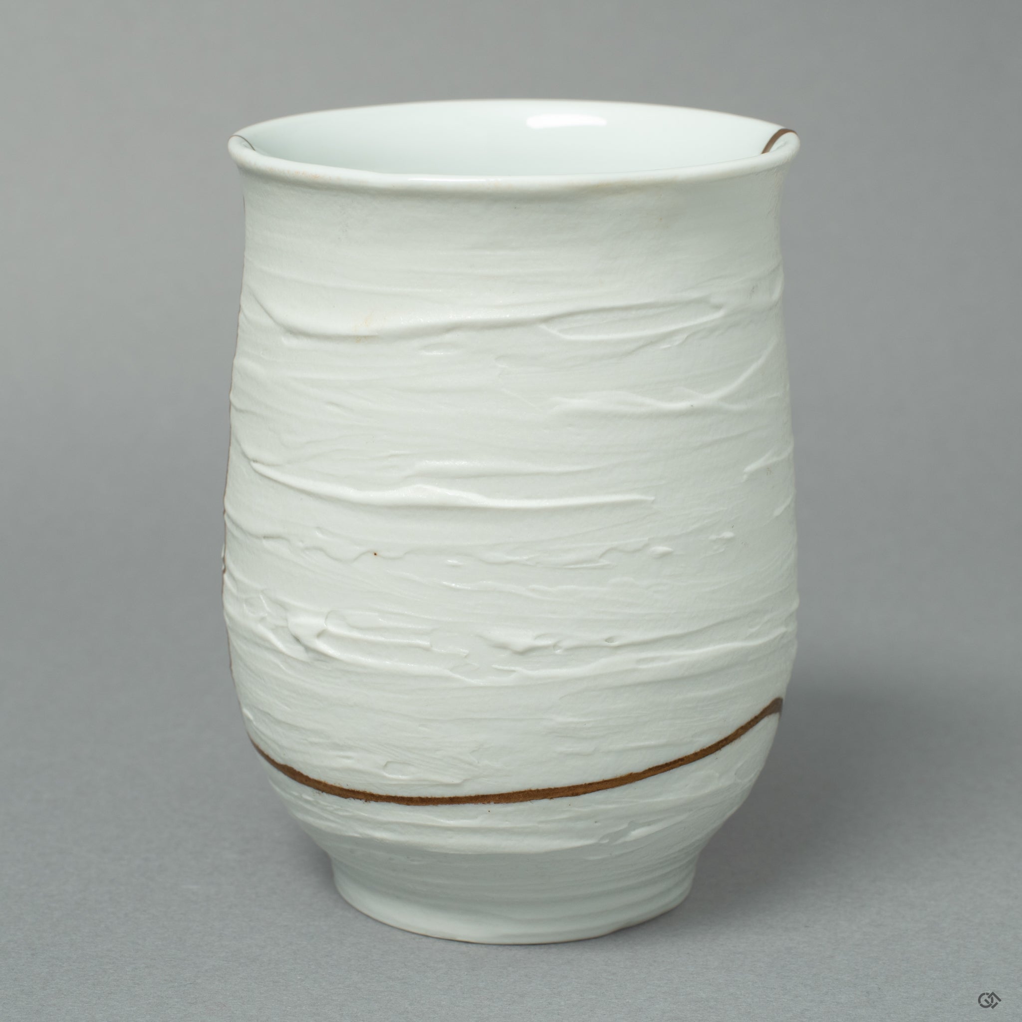 A study in contrast: the quiet, flawless surface of the Nabeshima porcelain in dialogue with the luminous, golden path of its restoration.