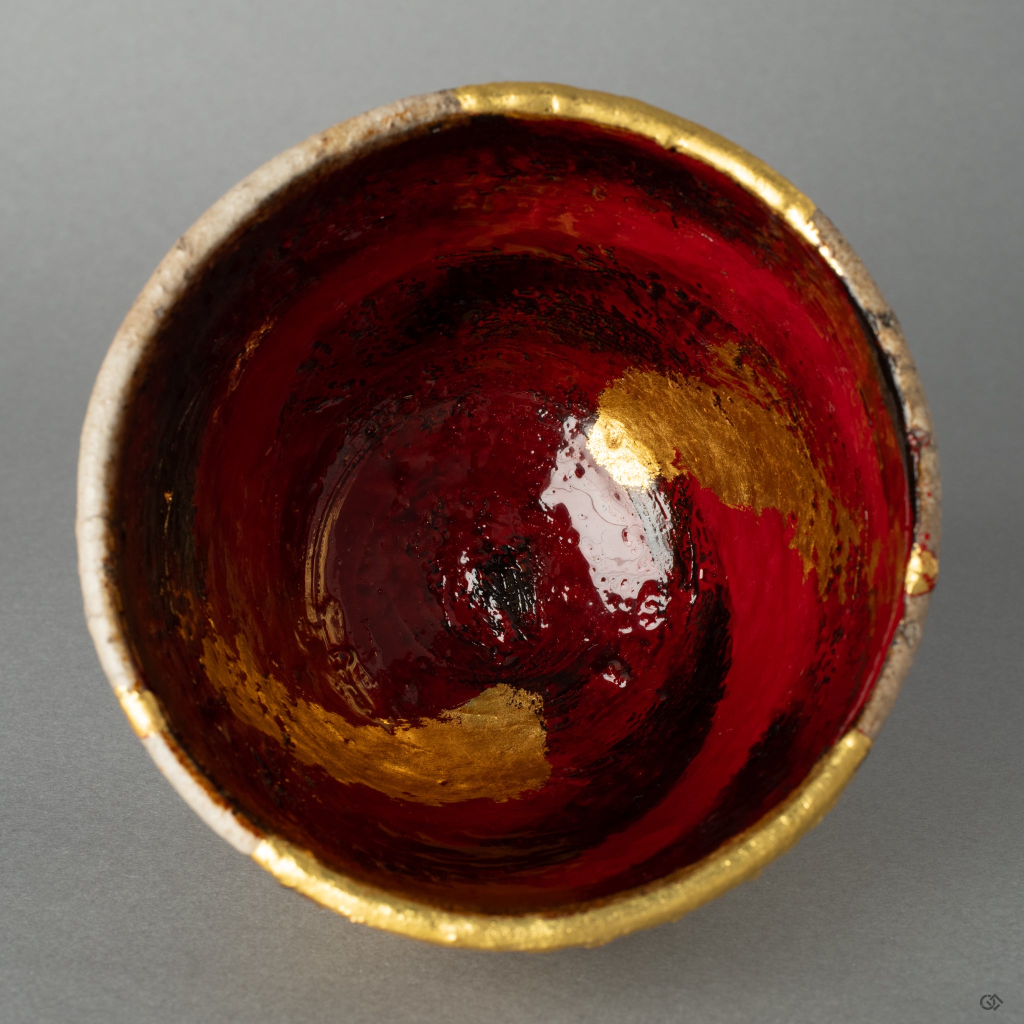 Top-down view into the restored Shigaraki kintsugi cup, its interior landscape offering a moment of contemplation on imperfection made beautiful.