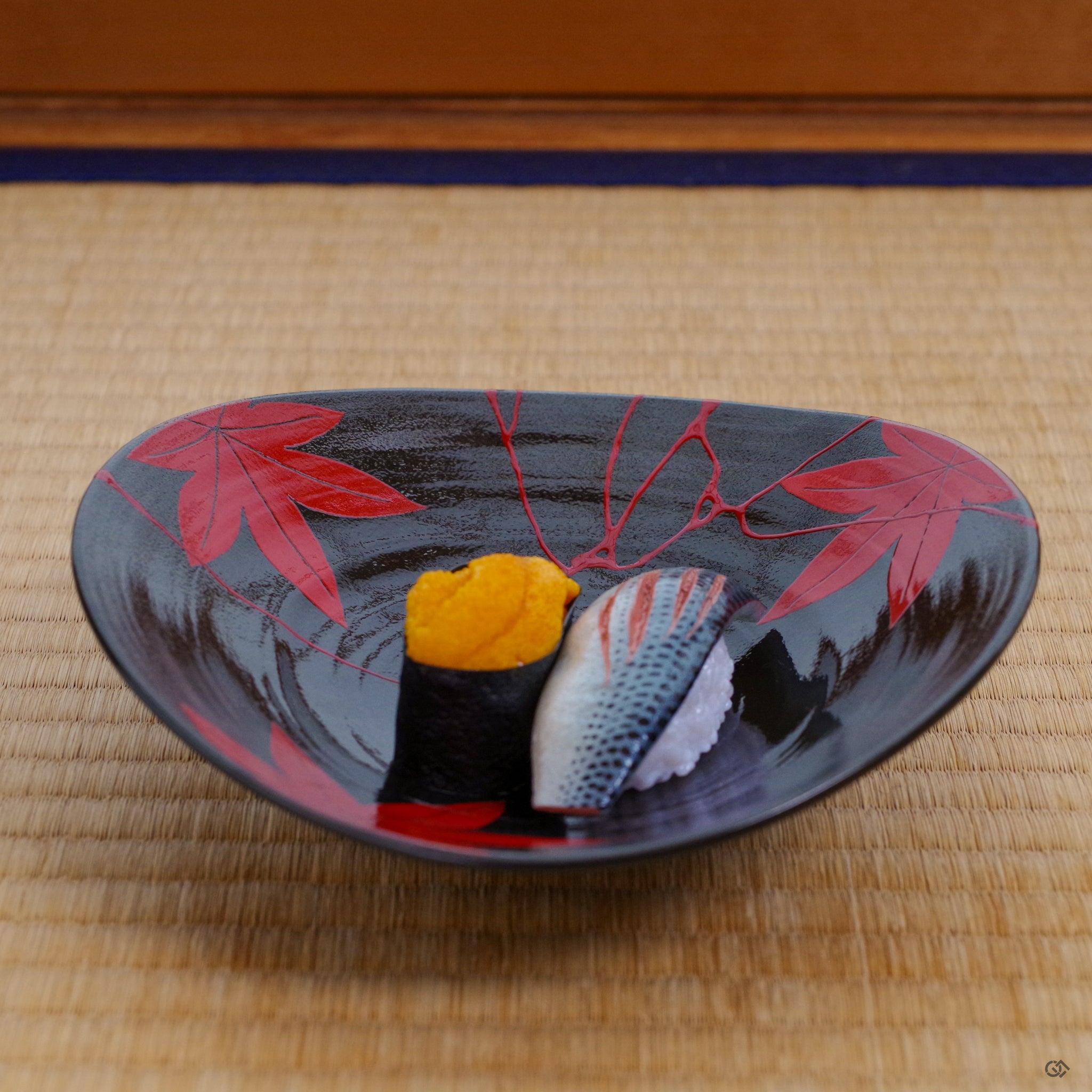 An Arita ware bowl, reborn with vermillion lacquer, held in a moment of quiet use, connecting the artistry of repair with daily life.