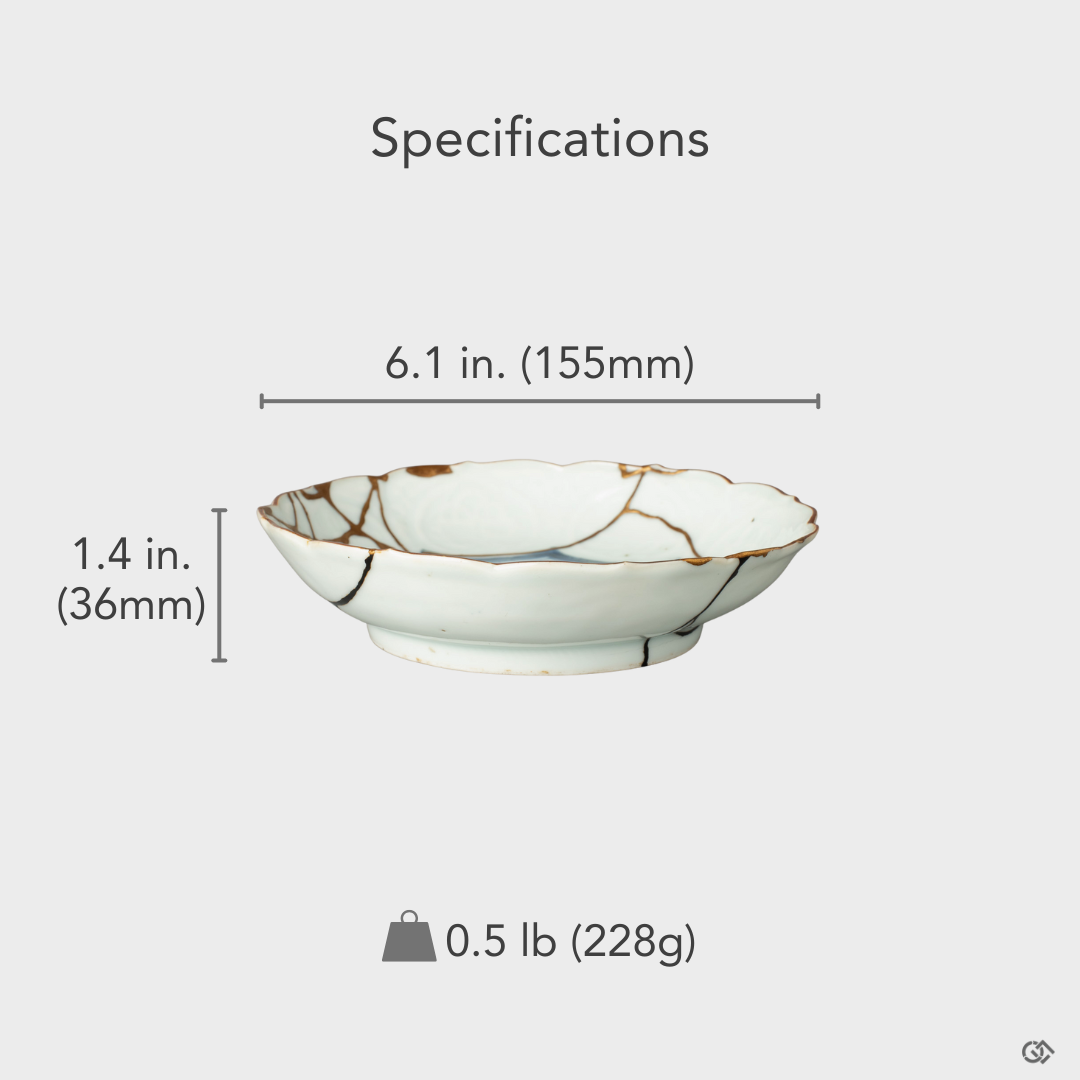 A size-reference image of the Ko-Imari kintsugi bowl, showing the scale of its artistic restoration, a physical philosophy in form.