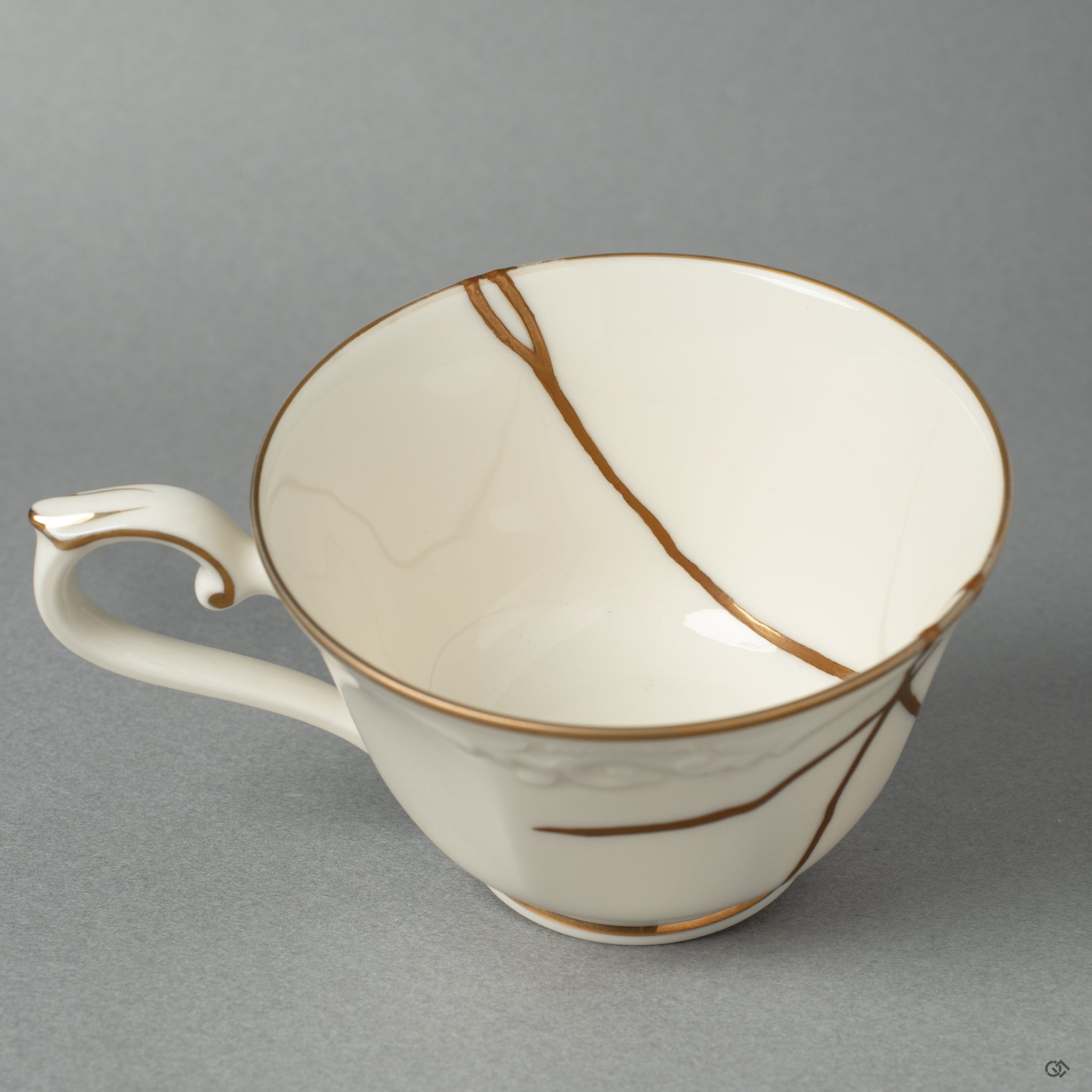 The sublime meeting of imperfection and preciousness in a detailed kintsugi repair, crafted with 24k gold and Urushi.