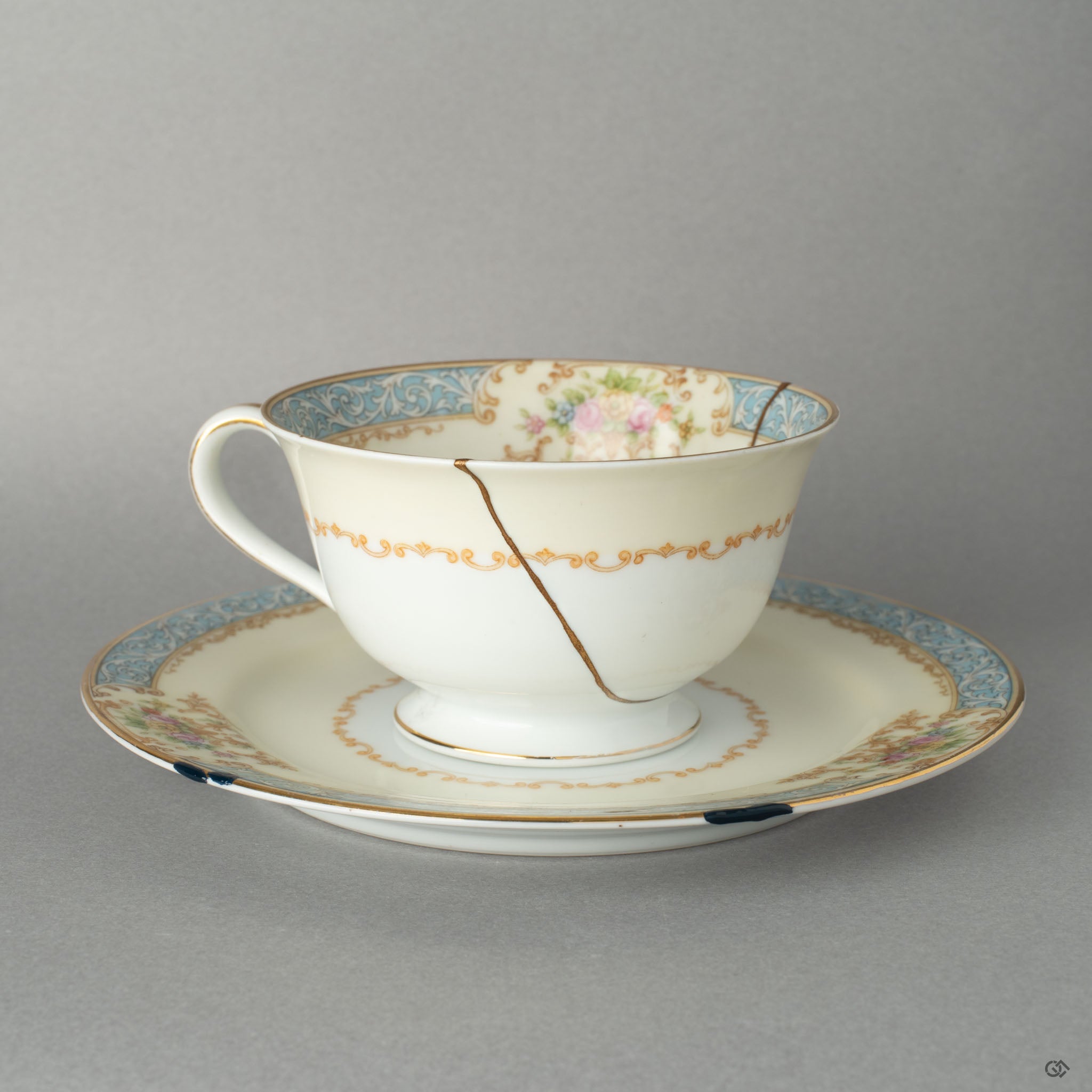 Front view of an Early Noritake kintsugi cup and saucer, renewed with 24K gold, giving this vintage set a new story to tell.