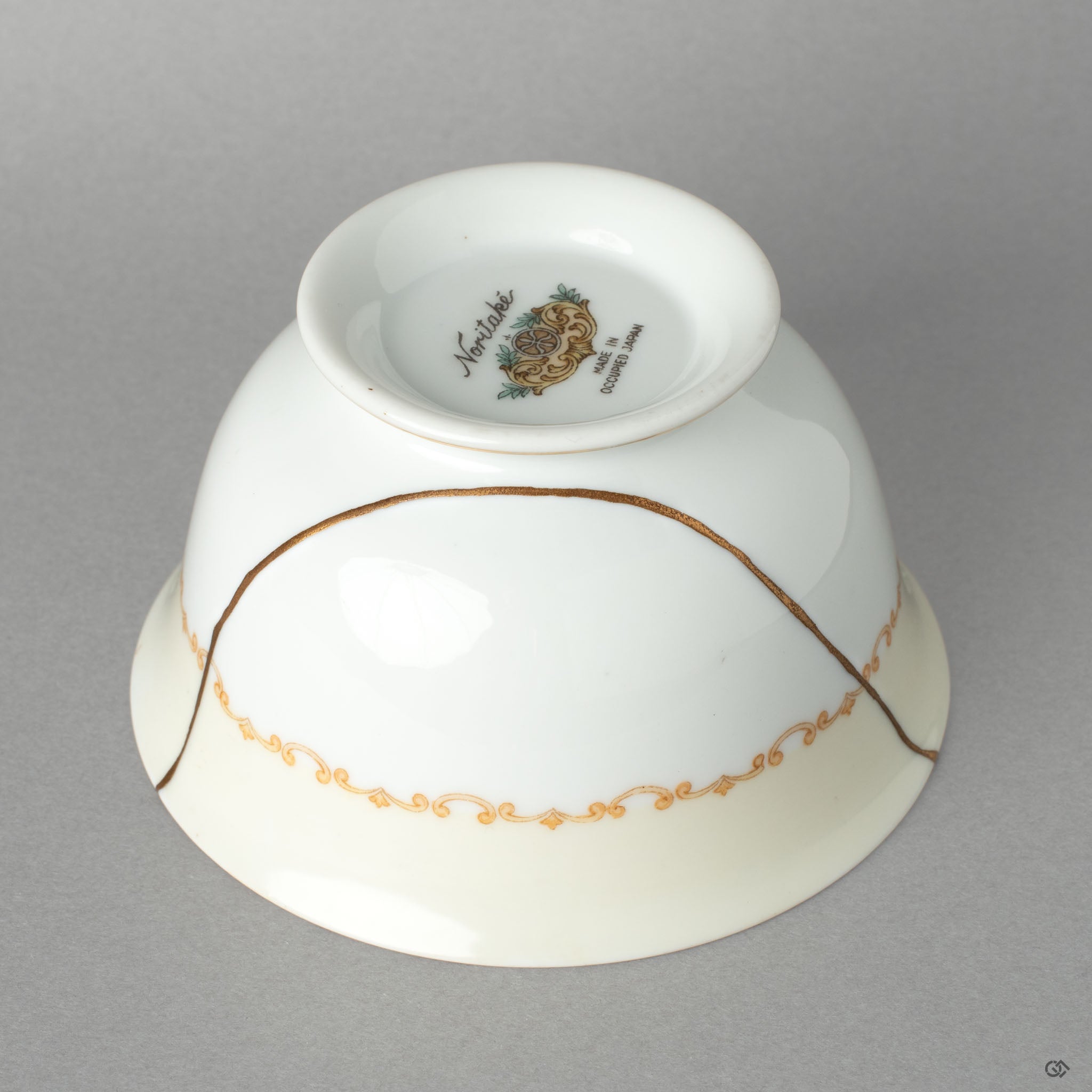 Side profile of the Noritake cup, its delicate kintsugi line a profound vision of resilience made beautiful.