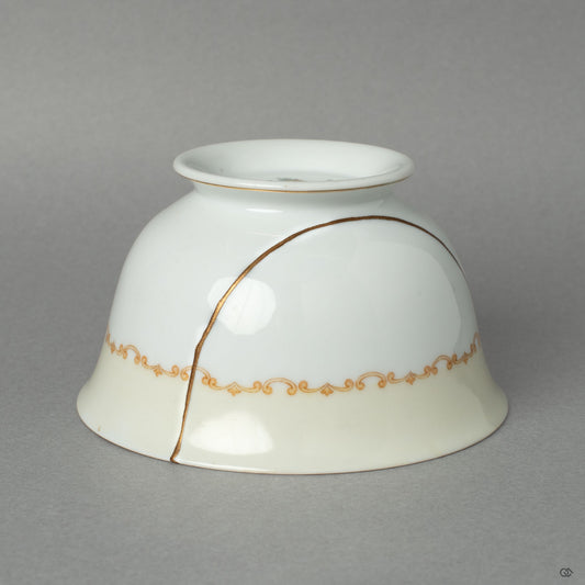 A different side view of the Early Noritake cup, its graceful kintsugi mend an act of honoring history and its journey through time.