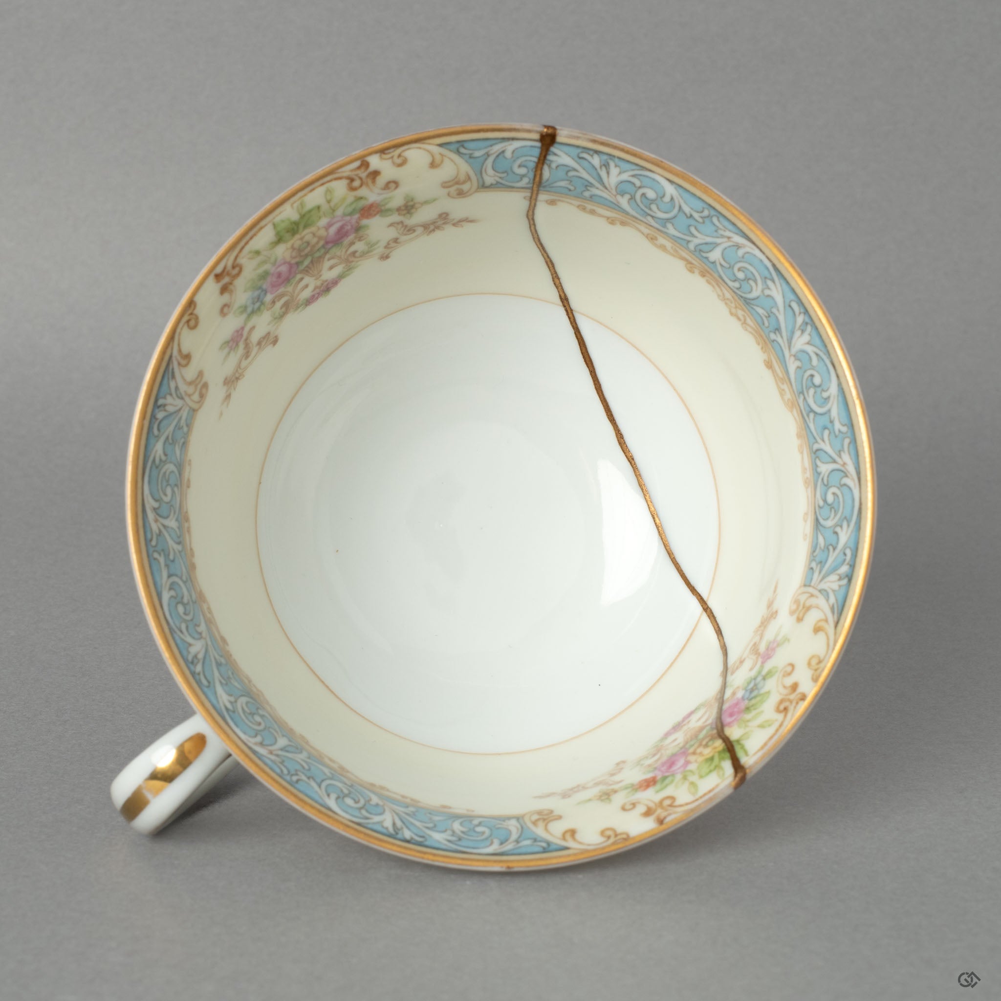 A top-down view into the Art Deco Noritake kintsugi cup, its golden seam inviting a moment of contemplation with every sip.