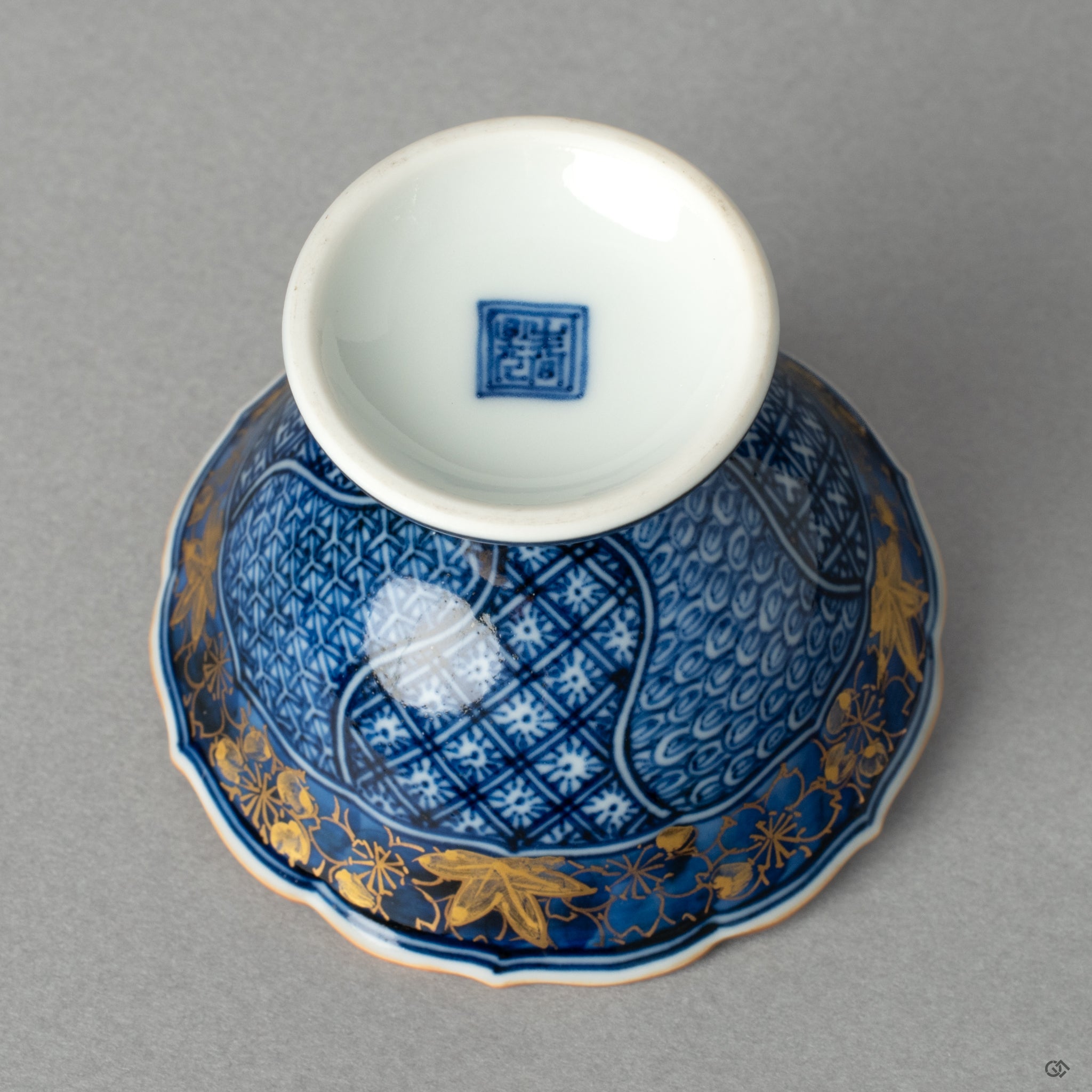 The back view of the Kyoto ware kintsugi cup, showcasing its graceful silhouette and fine porcelain, a mark of authentic Japanese craftsmanship.