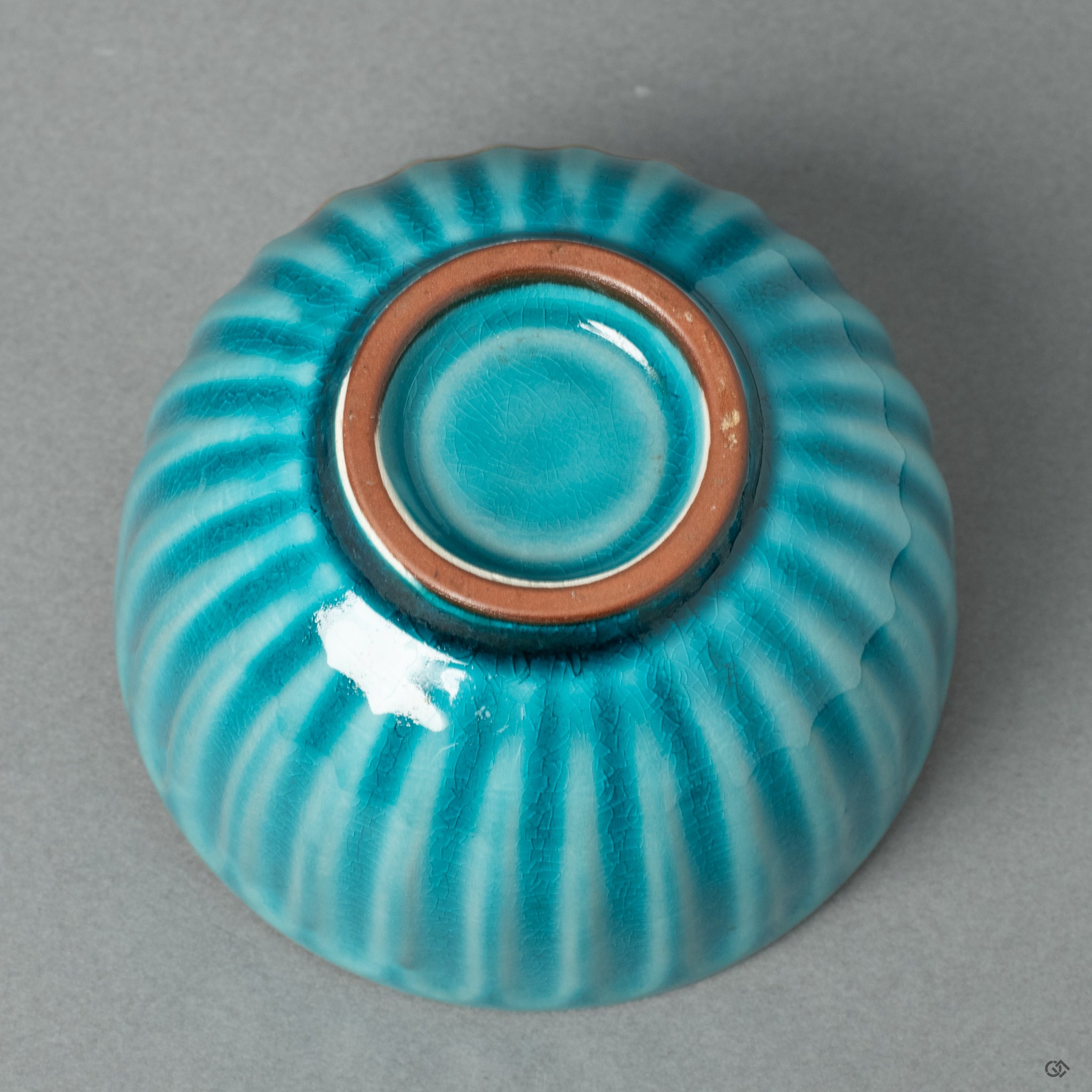 The footed base (koudai) of the silver Kintsugi sake cup, highlighting the clean, elegant form of the original Arita porcelain. This view showcases the seamless integration of historic ceramic and modern restorative art.