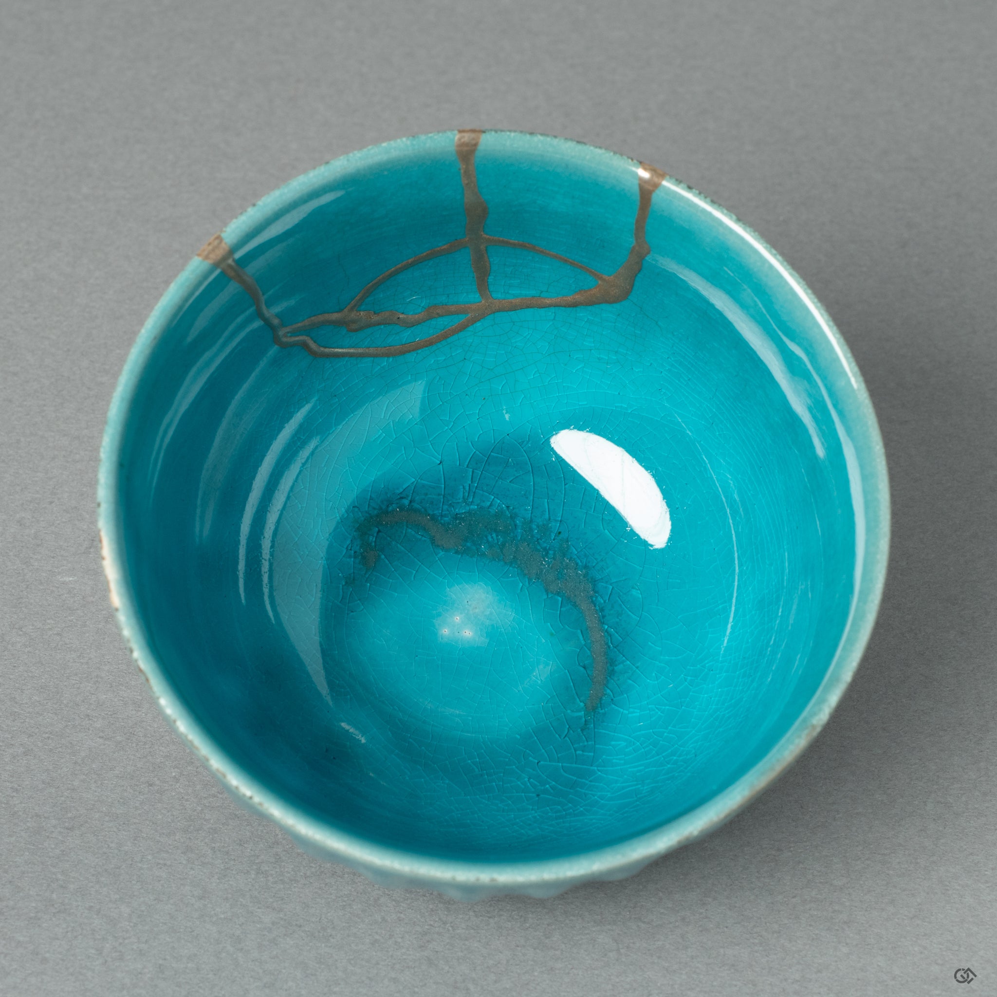 A top-down view into the Arita ware sake cup, revealing a delicate stream of silver Kintsugi flowing across the pristine white porcelain interior—a testament to serene, wabi-sabi elegance.