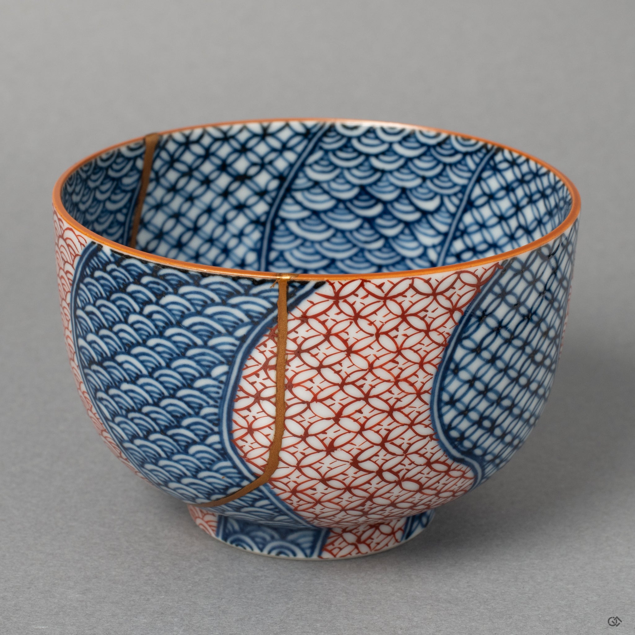Front view of an authentic Kyoto ware tea cup, showcasing its overall form and the elegant lines of its 24k gold Kintsugi repair.