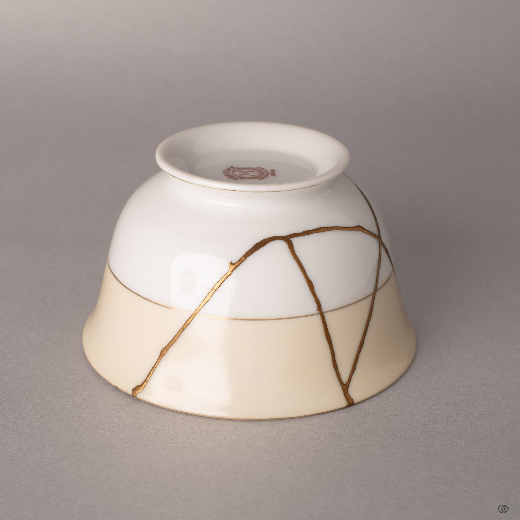 Detail of kintsugi repair on Art Deco Noritake: fragments reunited with museum-quality precision.