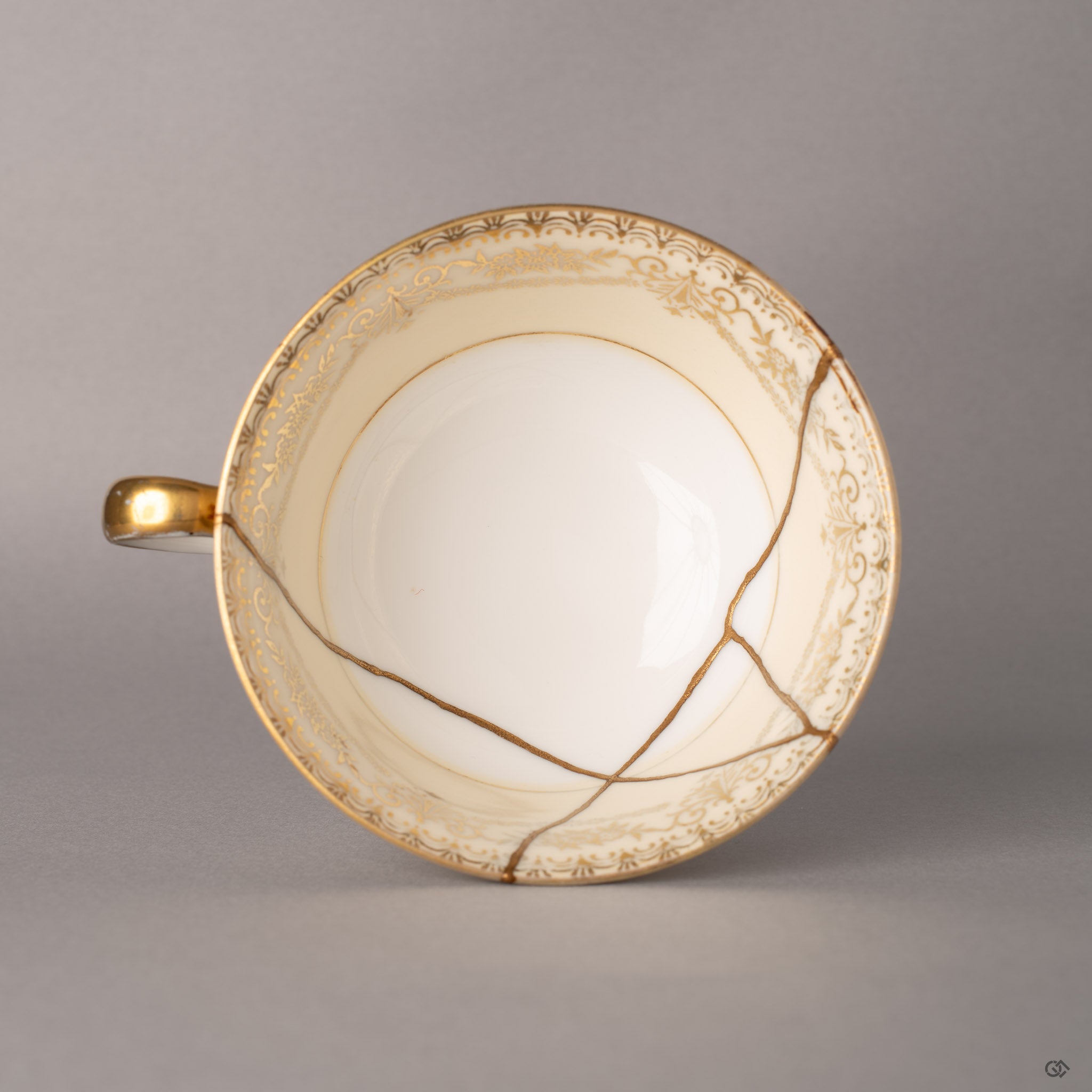 Looking into this Noritake kintsugi cup reveals gold threads marking where porcelain found its second story.