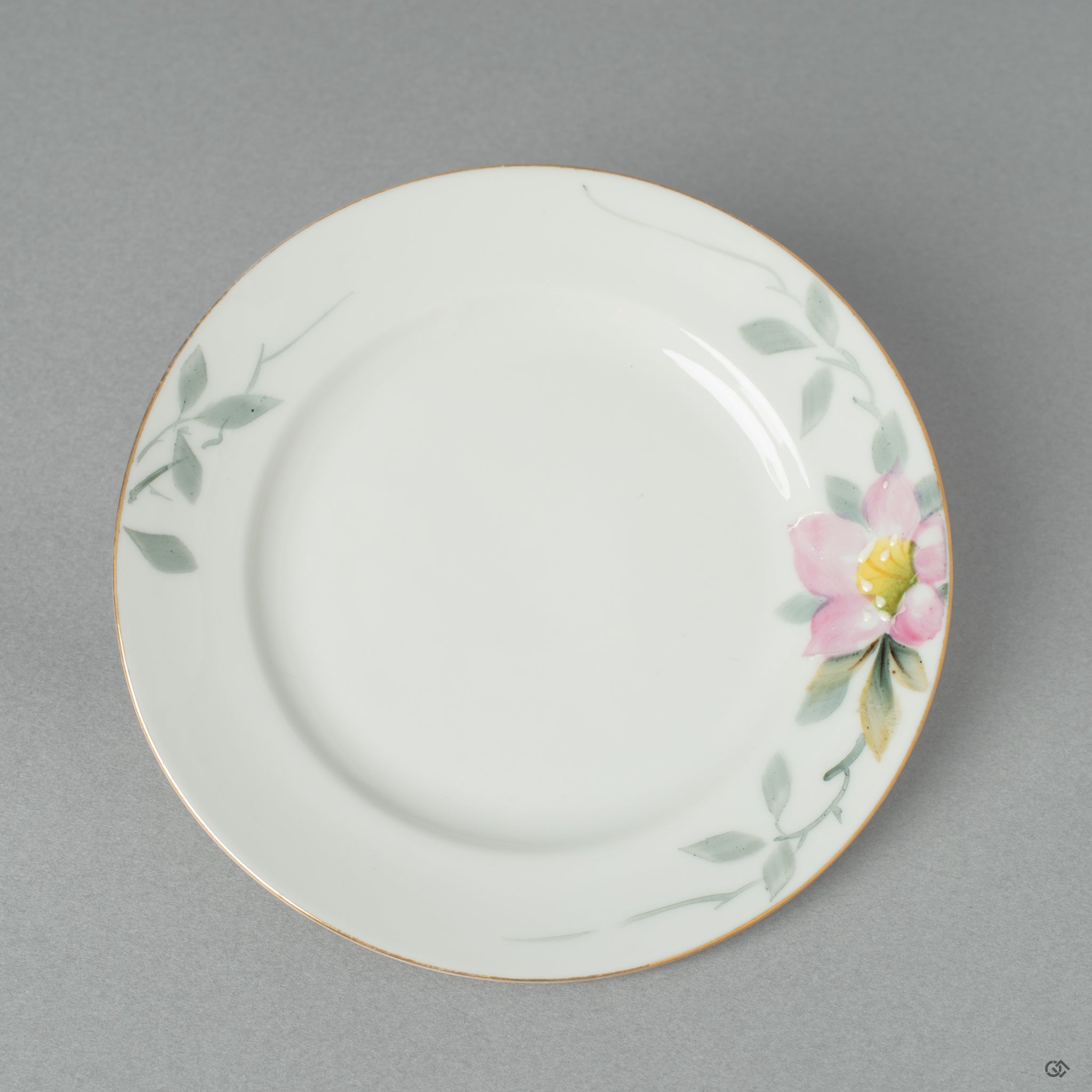 The original, unbroken surface of the Early Noritake saucer, its flawless vintage glaze a study in the elegance of a quiet beauty.