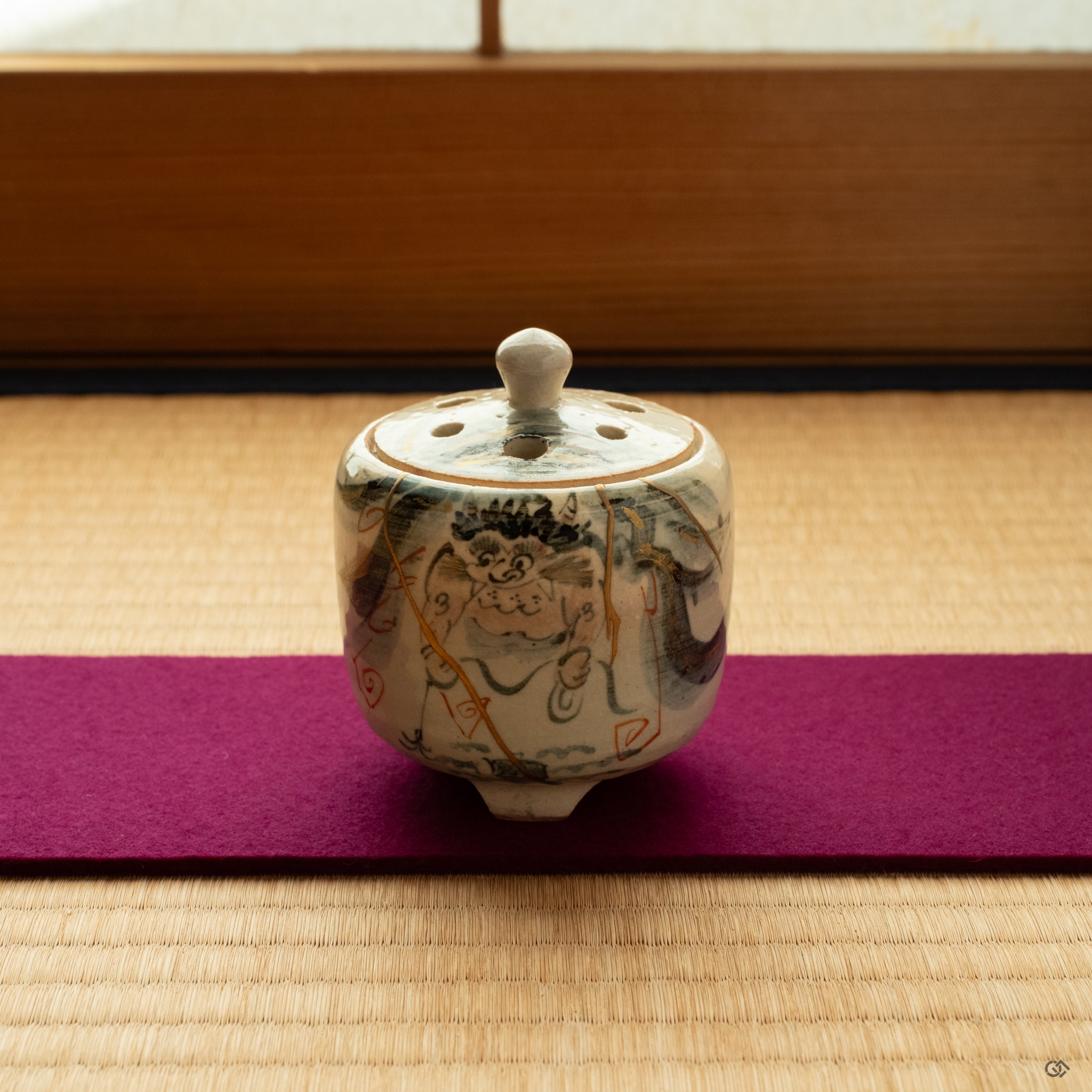 Kintsugi incense incense burner rests on tatami in soft natural light inviting a moment of contemplation. Restored with 24K gold.