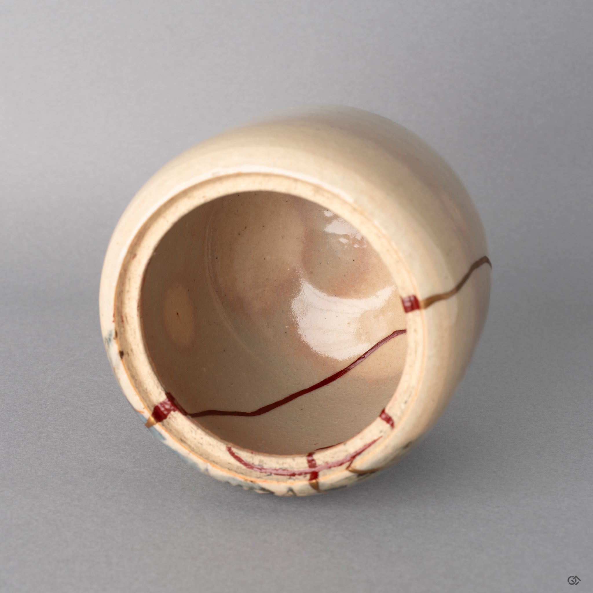 Detail of vermillion iro urushitsugi seams inside the kintsugi incense burner revealing profound visible resilience.