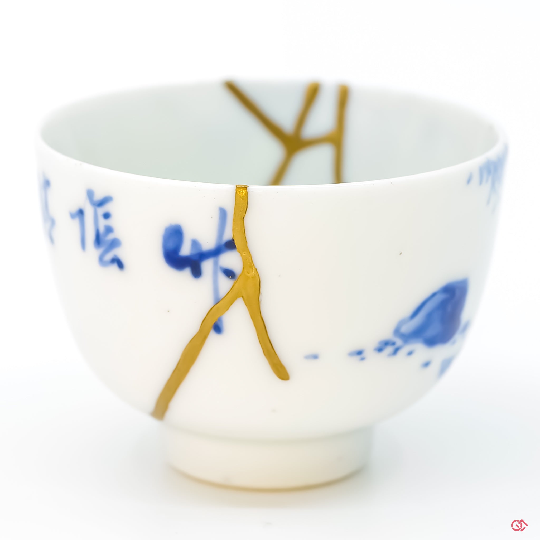 Close-up photo of genuine Kintsugi pottery, highlighting the artisan's intricate repair work and the unique character of each piece. Shop now.