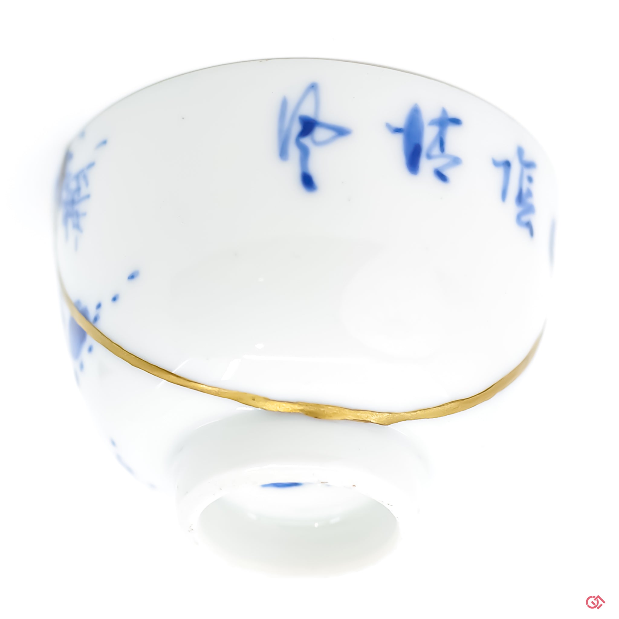 Close-up of hand-applied gold leaf in Kintsugi, showcasing the artisan's skill and the inherent value of the restored piece.