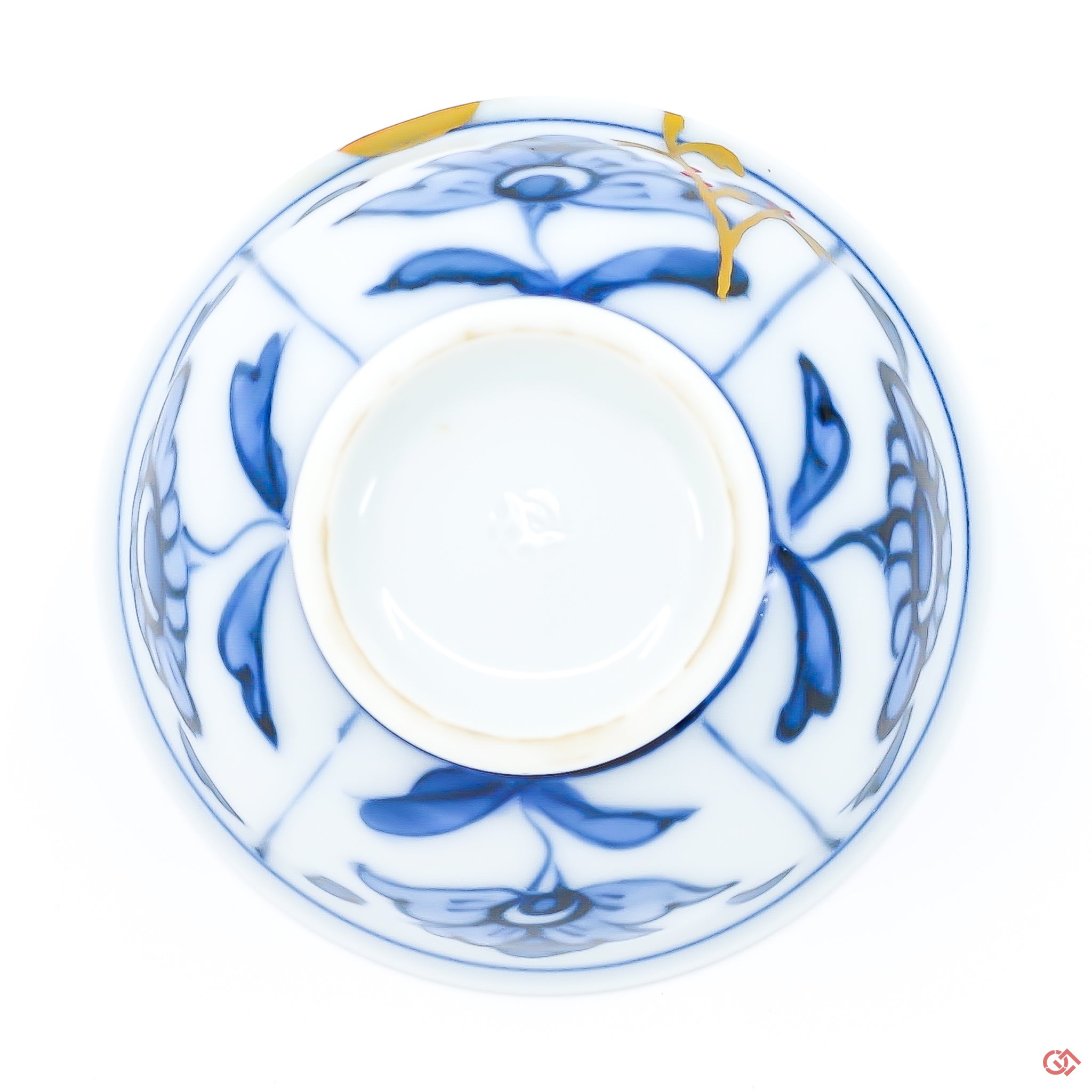 Photo of the bottom side of an authentic Kintsugi pottery piece, showing its overall design and features