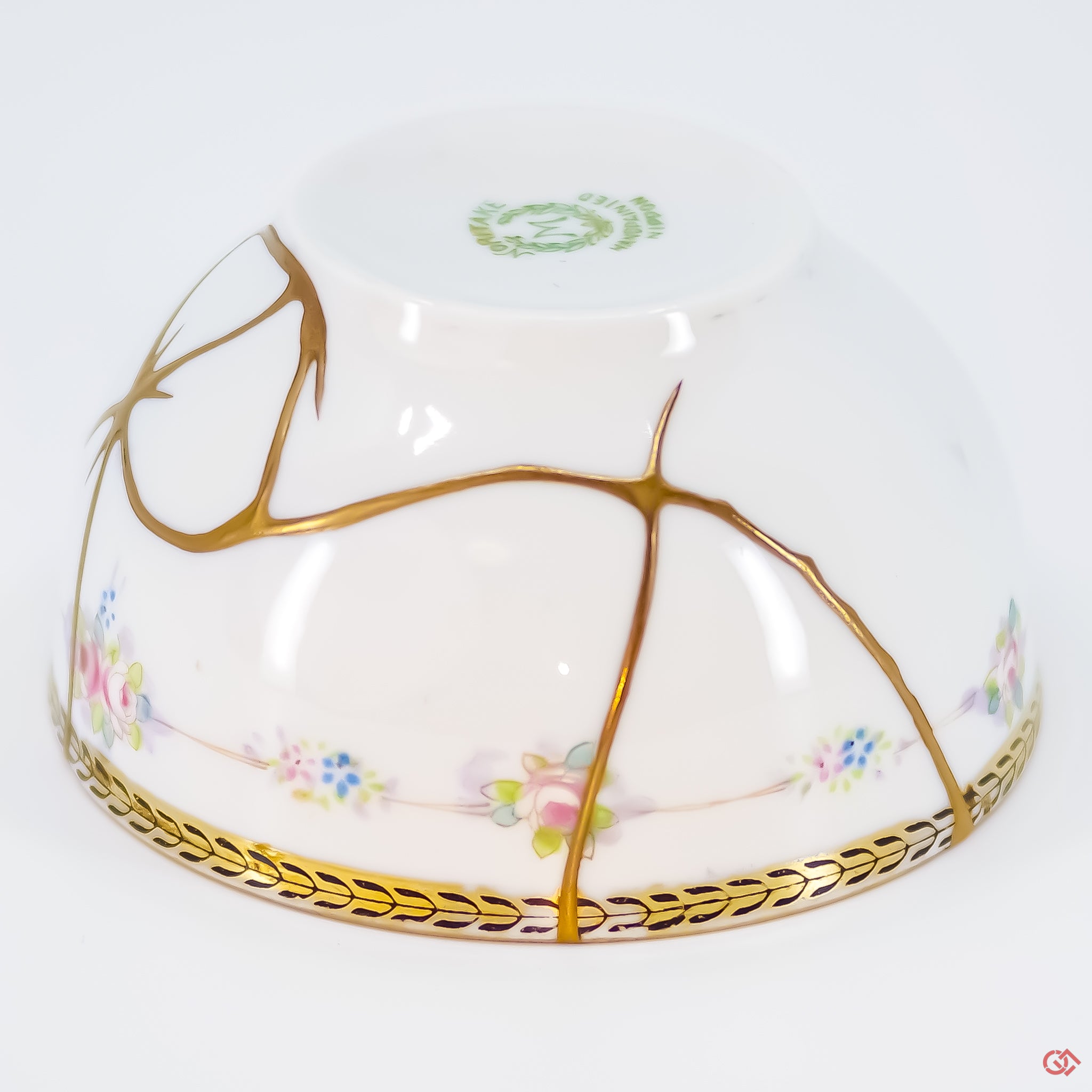 Close-up photo of an authentic Kintsugi pottery piece, showing the detail of its repairs and craftsmanship