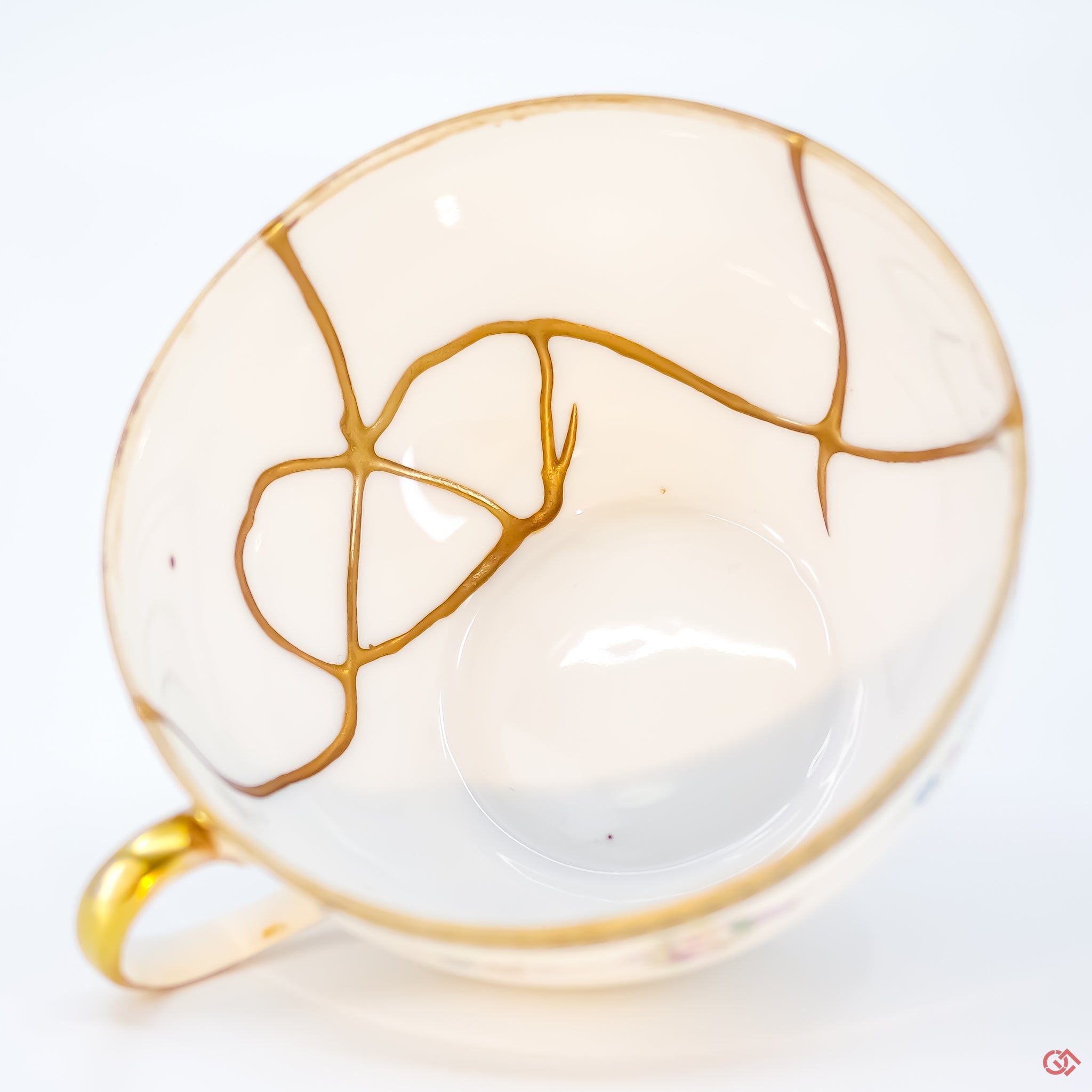 Close-up photo of an authentic Kintsugi pottery piece, showing the detail of its repairs and craftsmanship