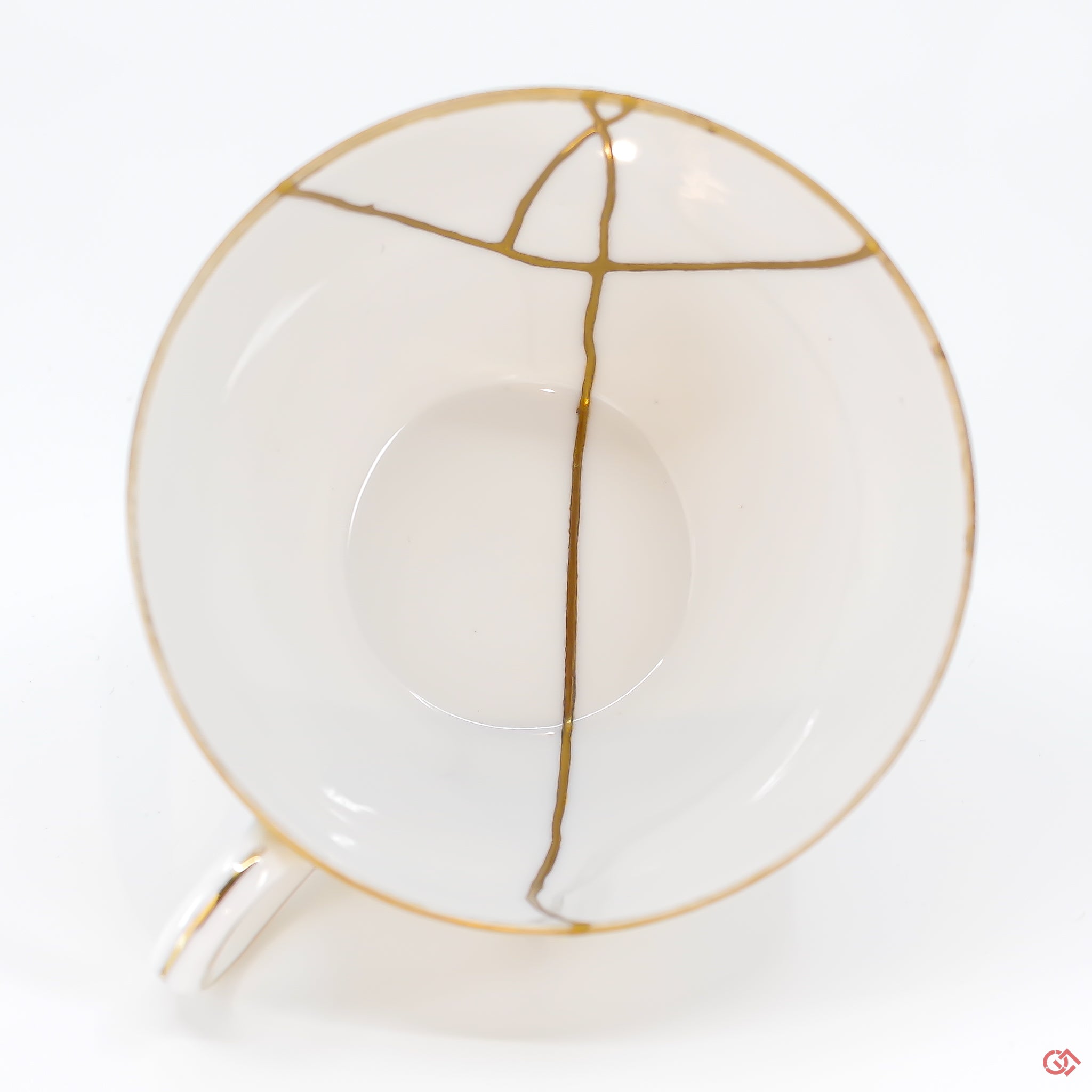 A photo of the top of an authentic Kintsugi pottery piece, showing its overall design and features.