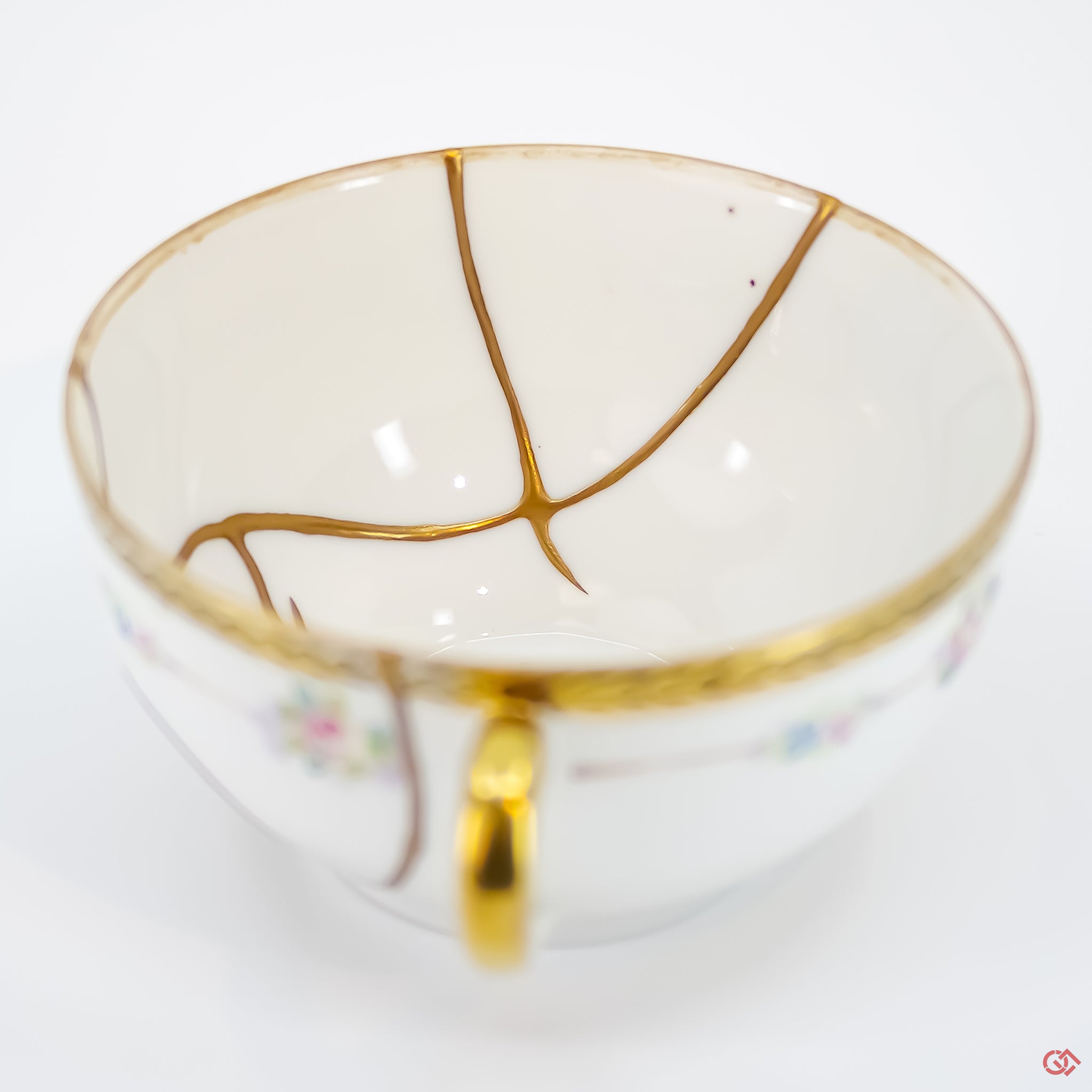 Close-up photo of an authentic Kintsugi pottery piece, showing the detail of its repairs and craftsmanship
