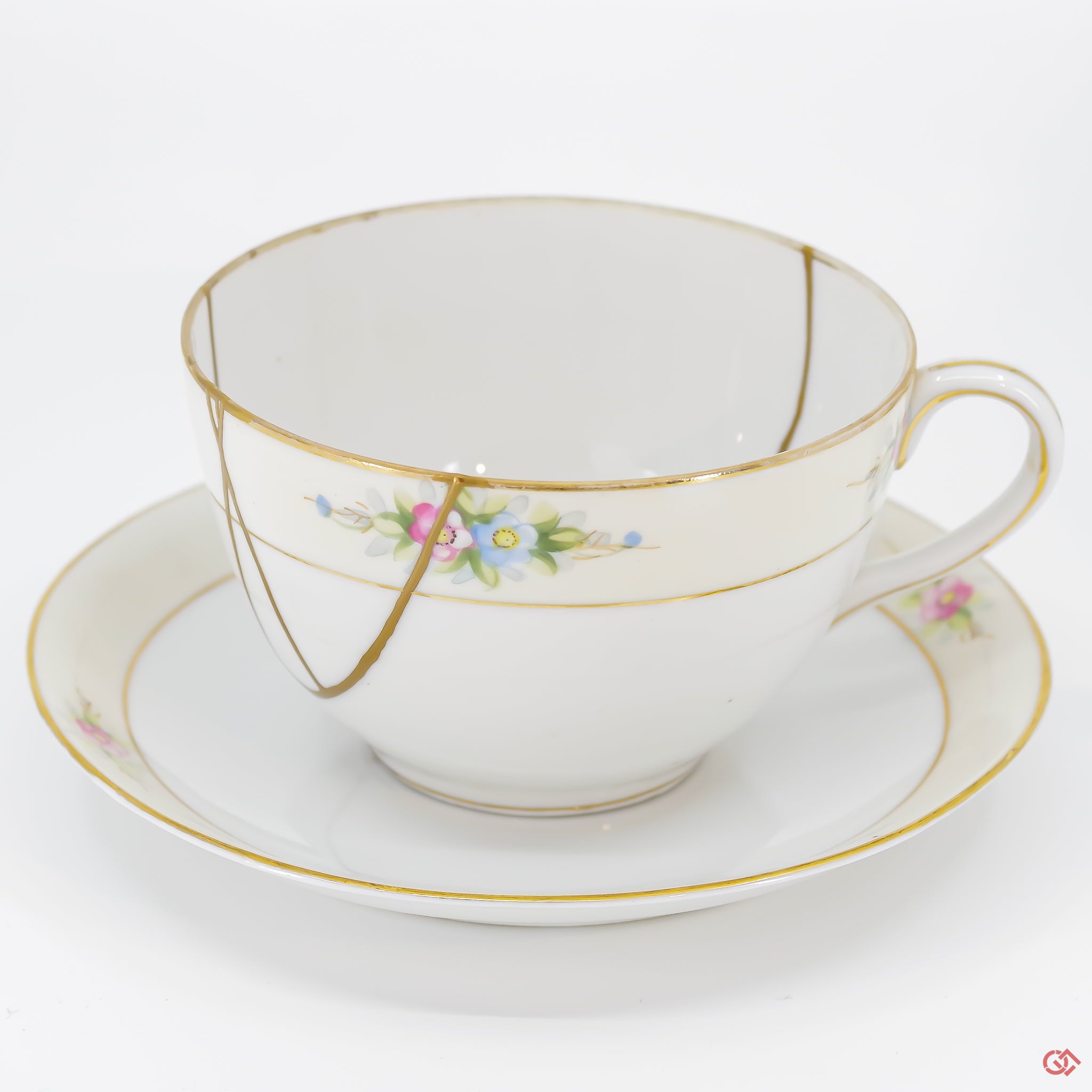 A close-up photo of an authentic Kintsugi pottery piece, showing the detail of its repairs and craftsmanship.
