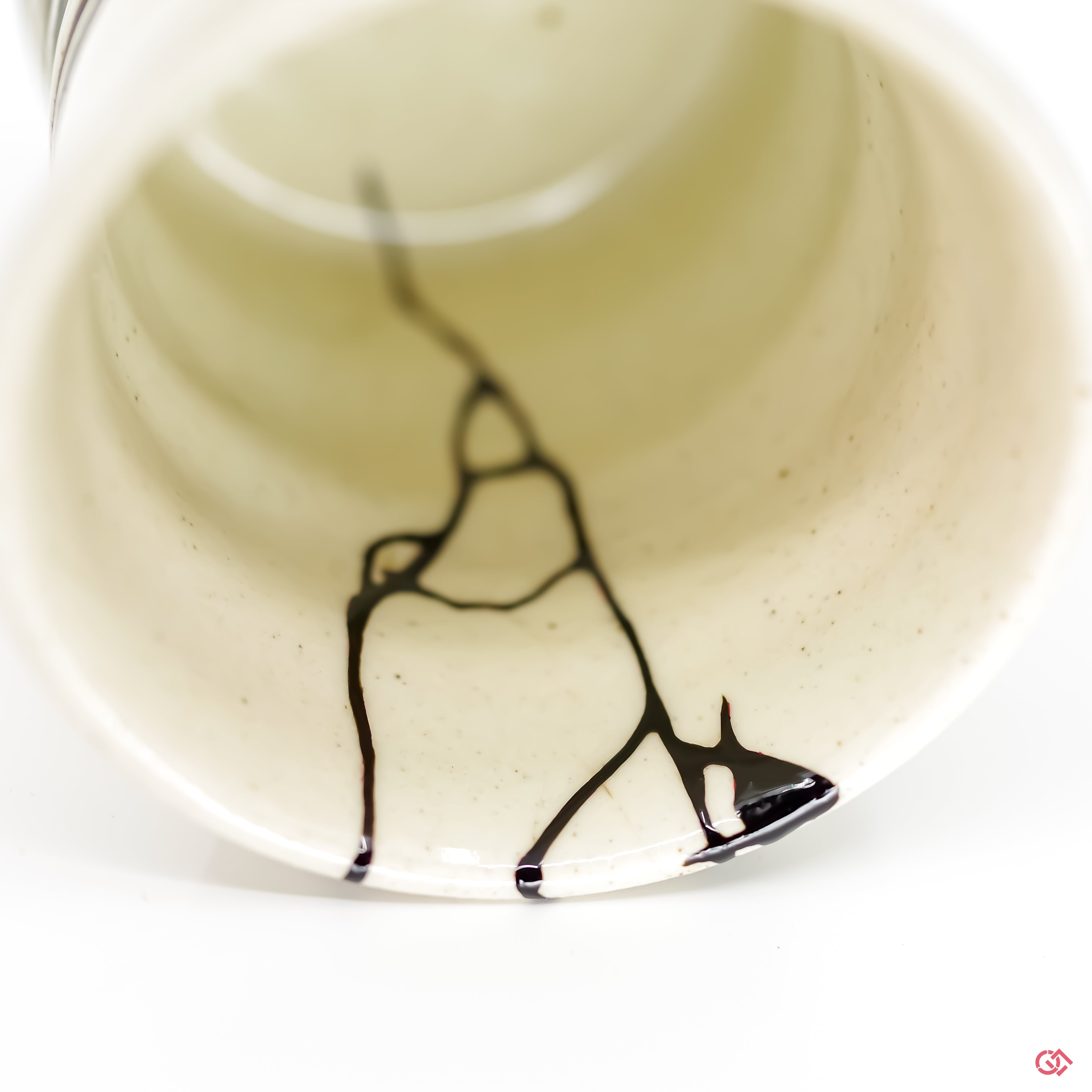 Detailed view of Kintsugi repair, showcasing craftsmanship.