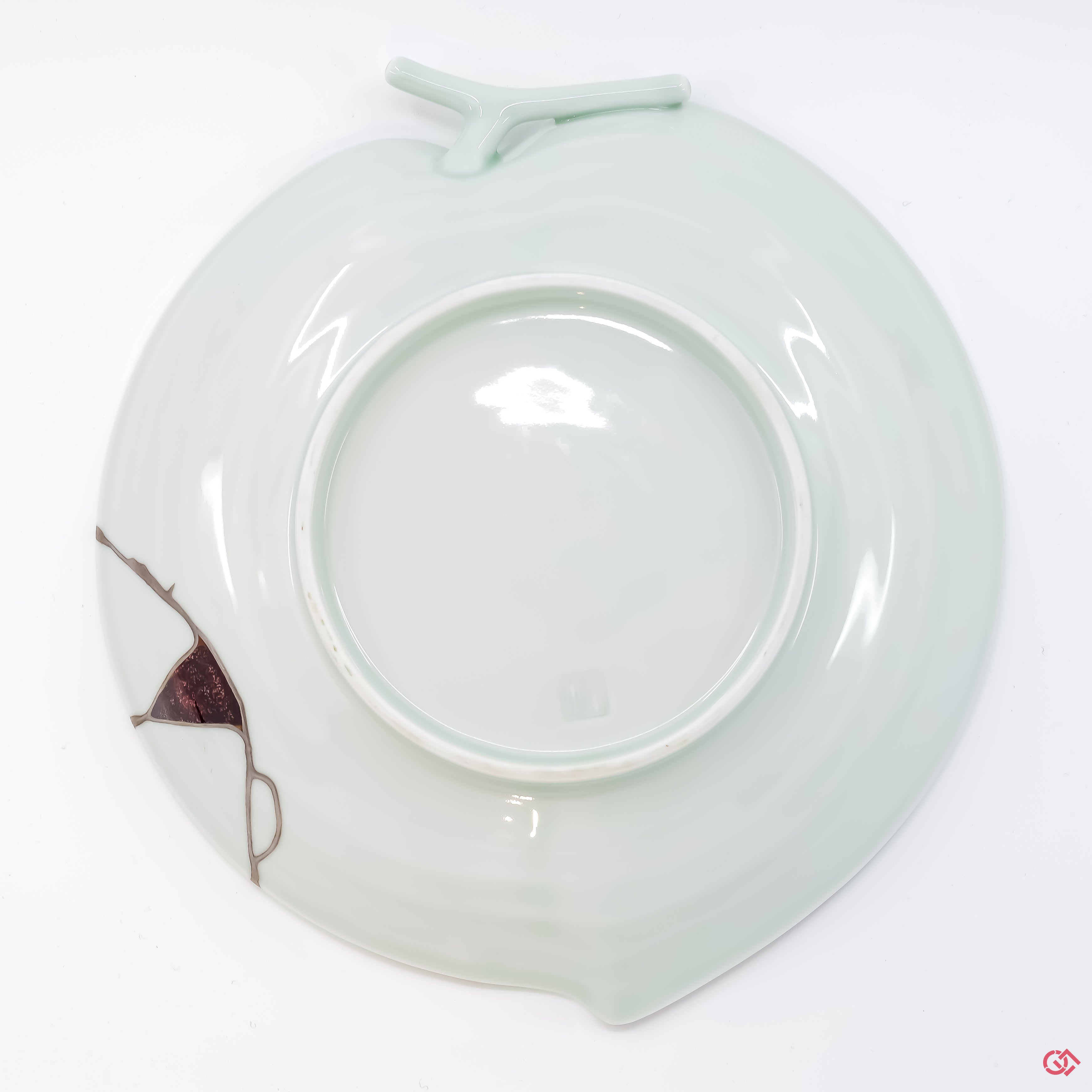 Photo of the bottom side of an authentic Kintsugi pottery, showing its overall design and features