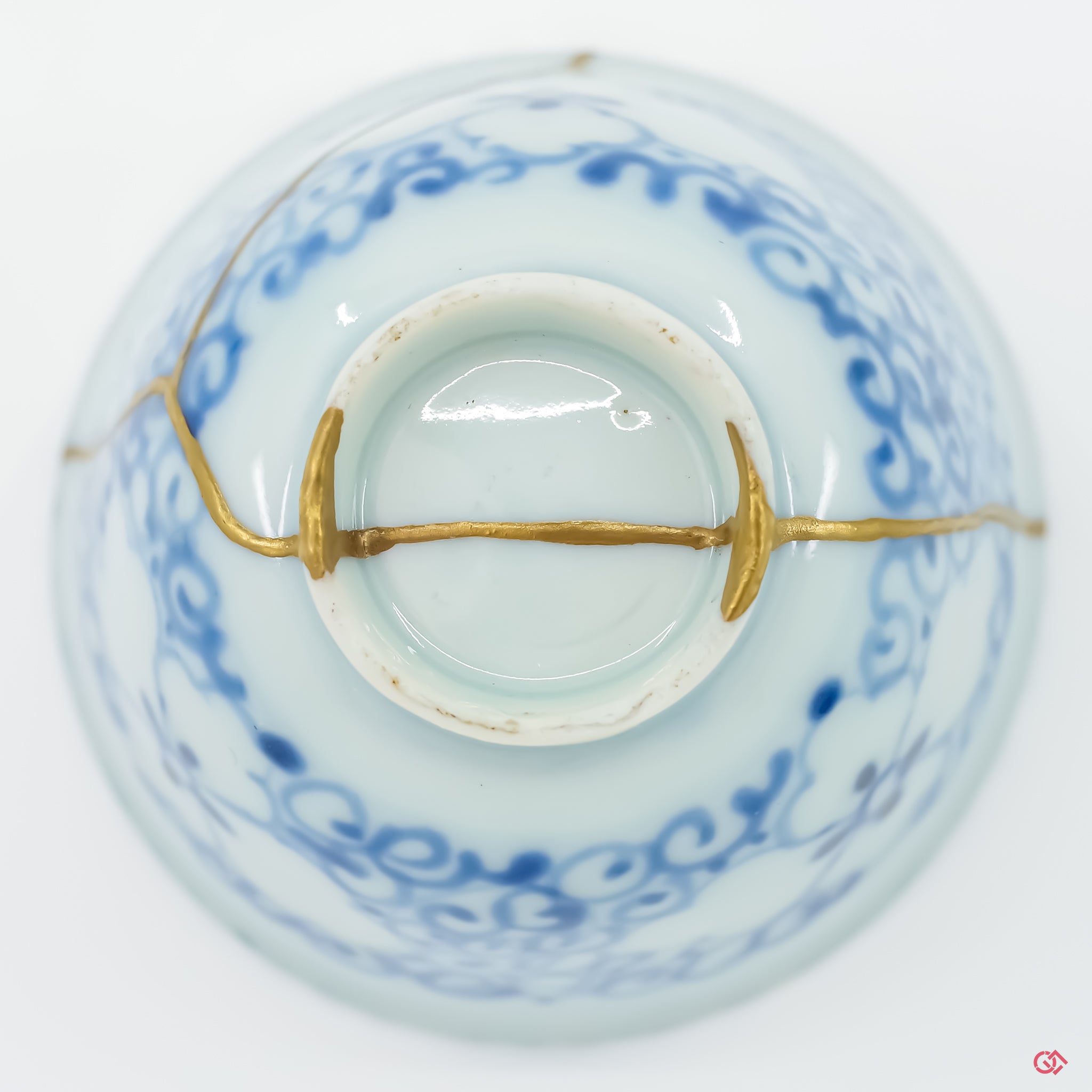 Underside view of authentic Kintsugi pottery, showcasing repair details and craftsmanship.