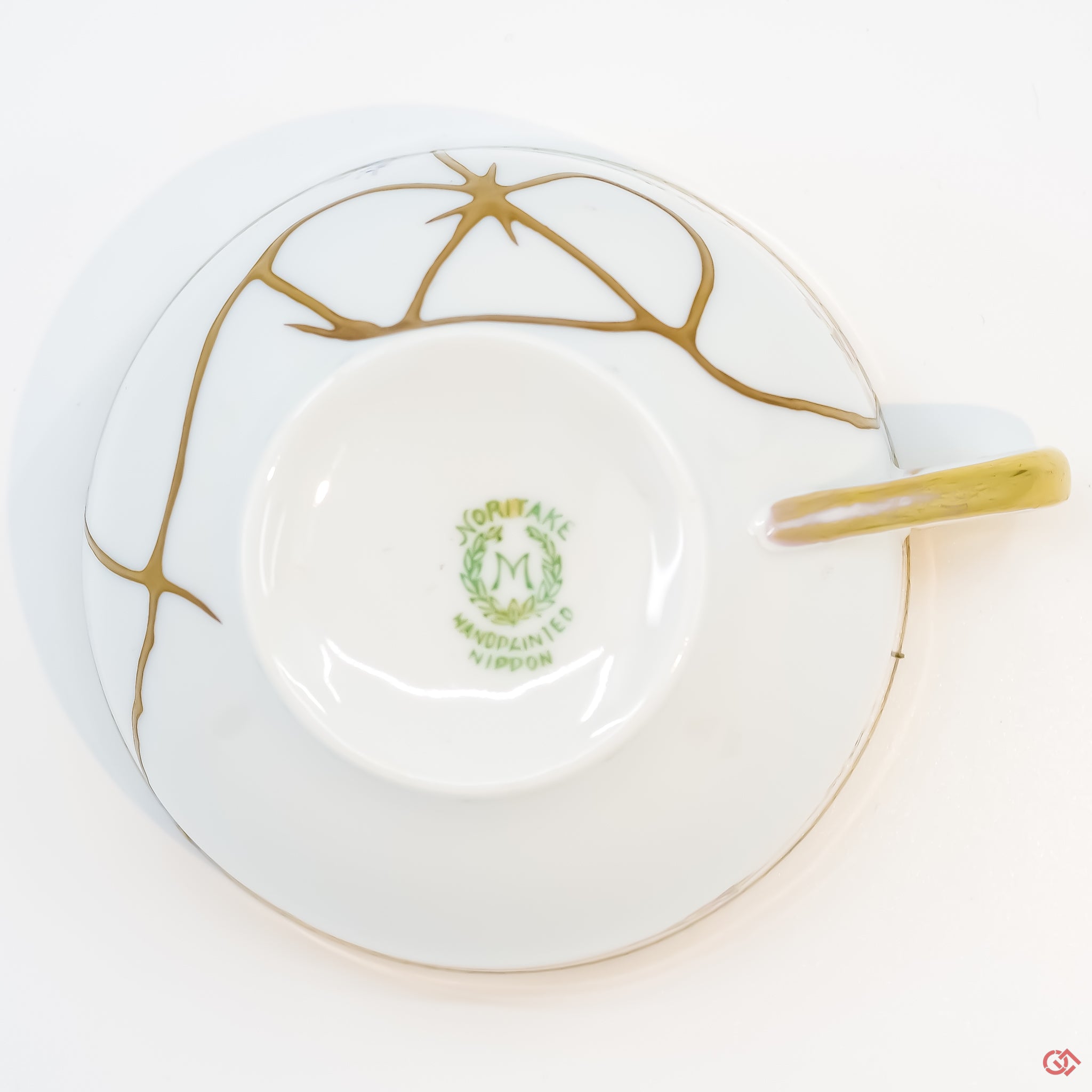 Photo of the bottom side of an authentic Kintsugi pottery piece, showing its overall design and features