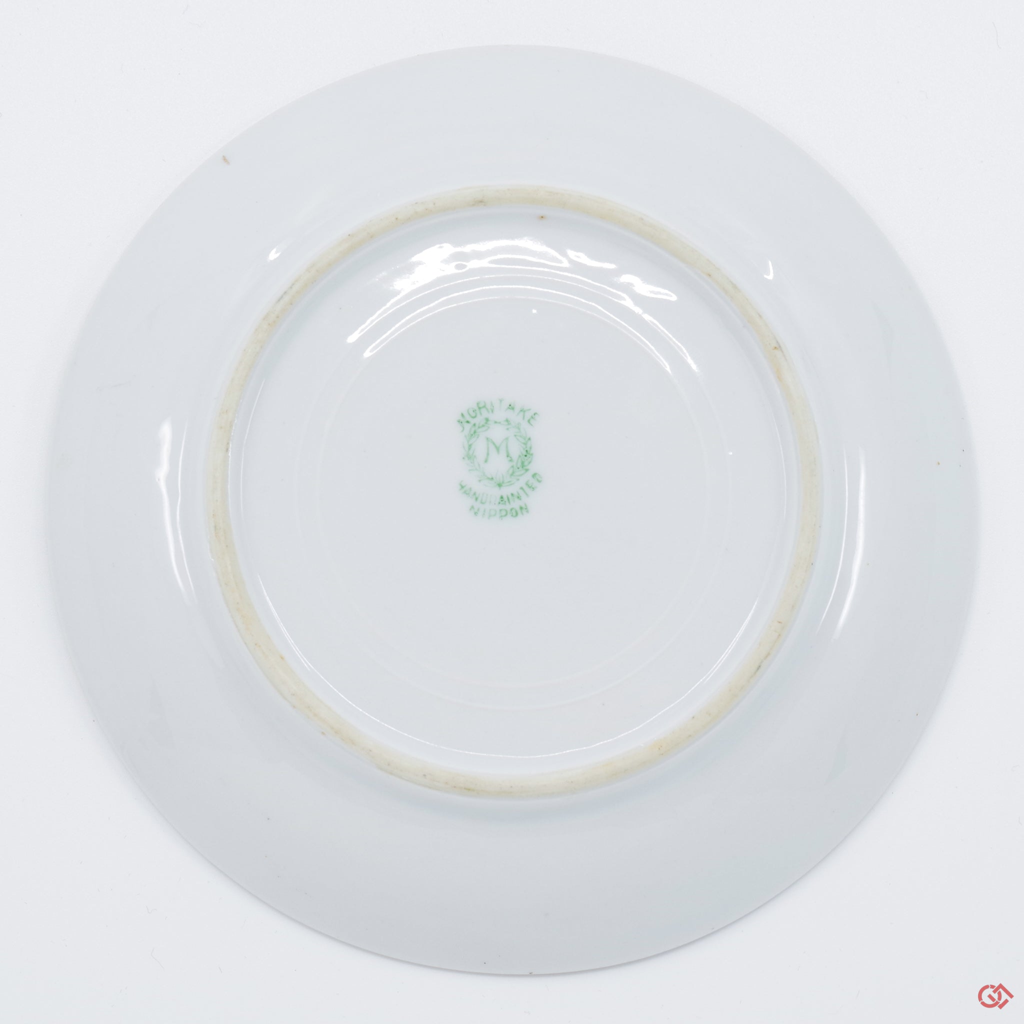 Photo of the bottom side of an authentic Kintsugi pottery piece, showing its overall design and features