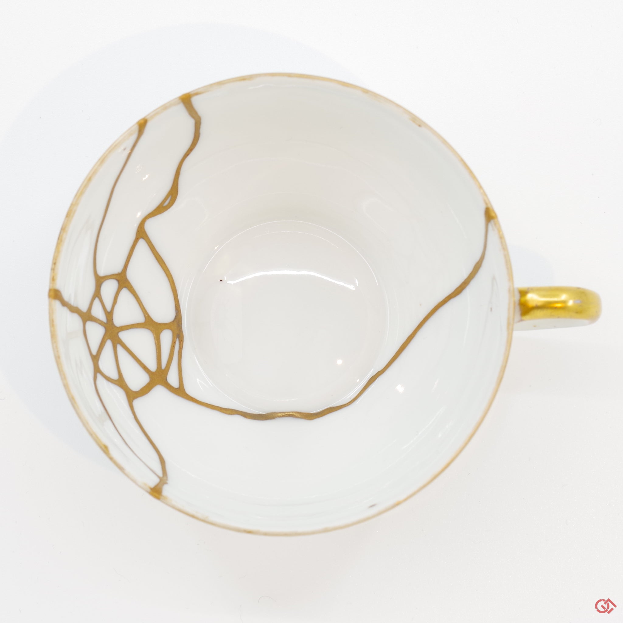 Photo of the top side of an authentic Kintsugi pottery piece, showing its overall design and features