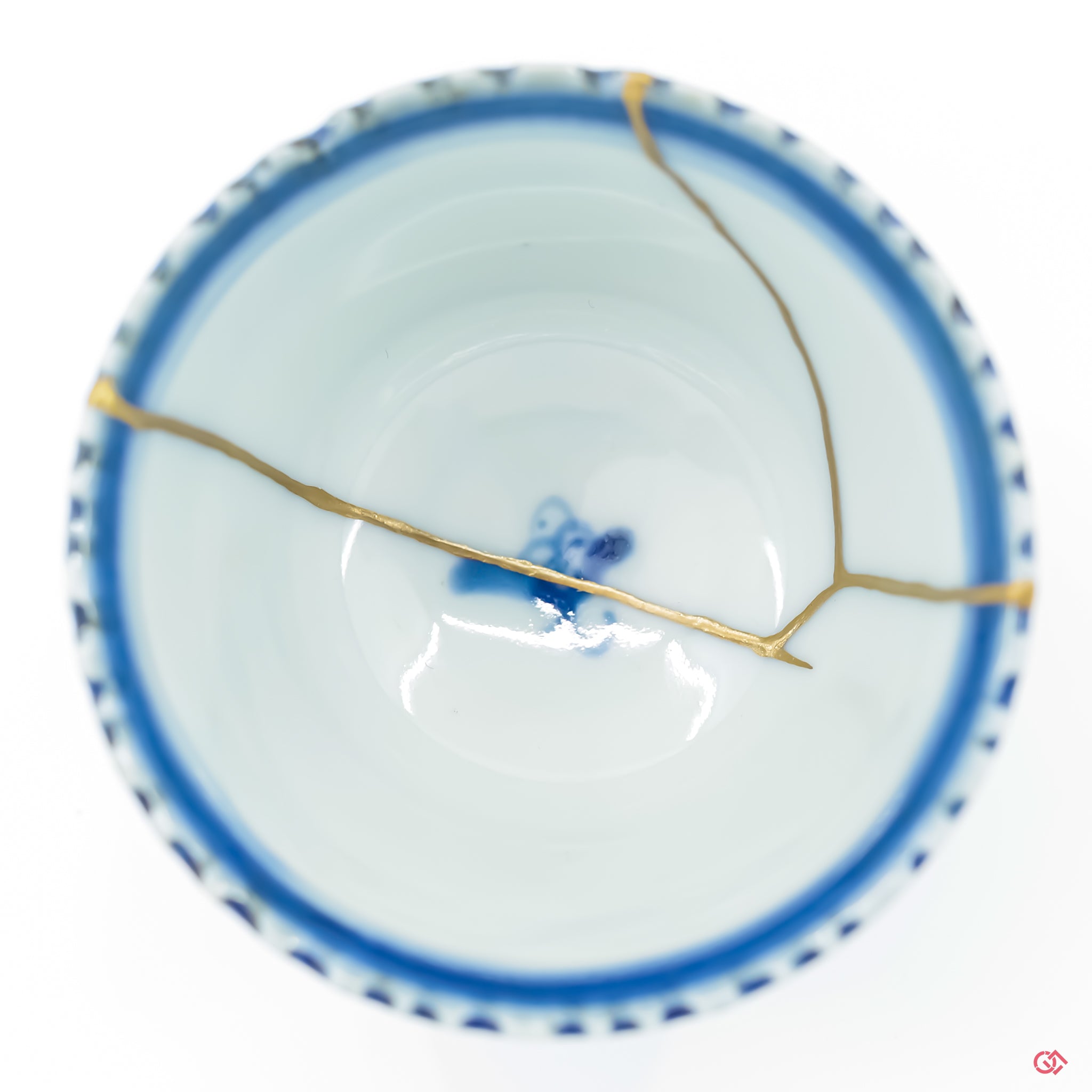 Close up of a kintsugi repaired crack, with clear visual of the gold adhered to the ceramic.