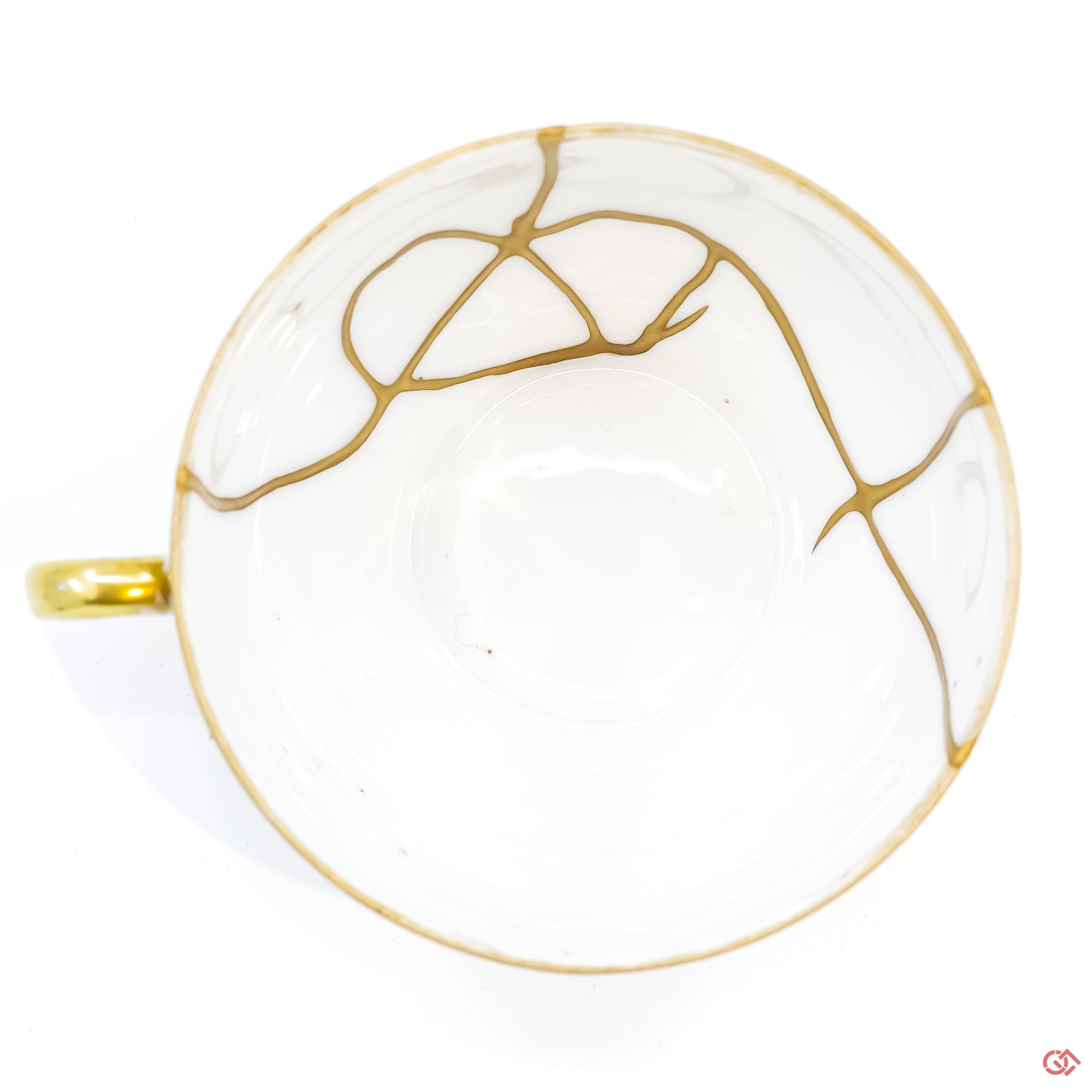Photo of the top side of an authentic Kintsugi pottery piece, showing its overall design and features