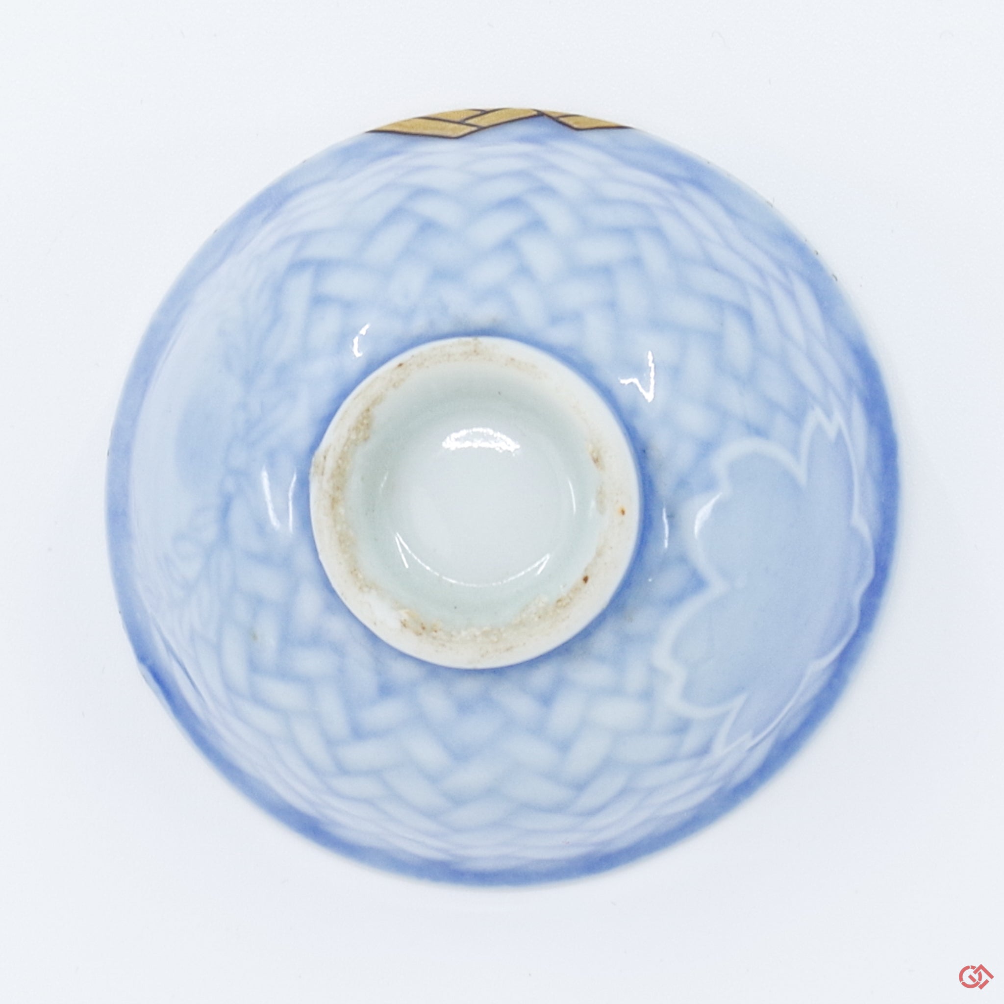 Photo of the bottom side of an authentic Kintsugi pottery piece, showing its overall design and features