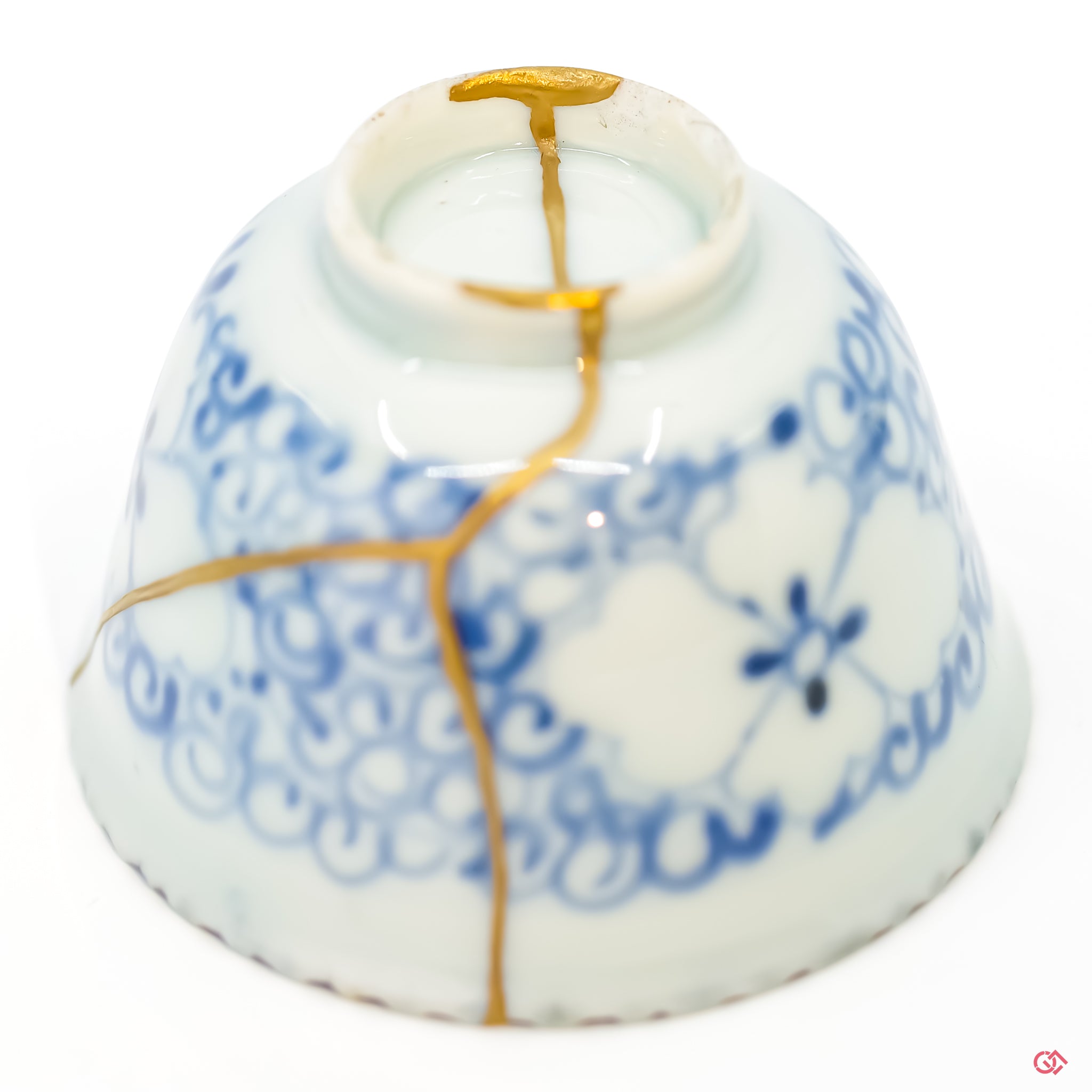 Intricate Kintsugi repair detail, highlighting the texture of gold on a restored ceramic piece.
