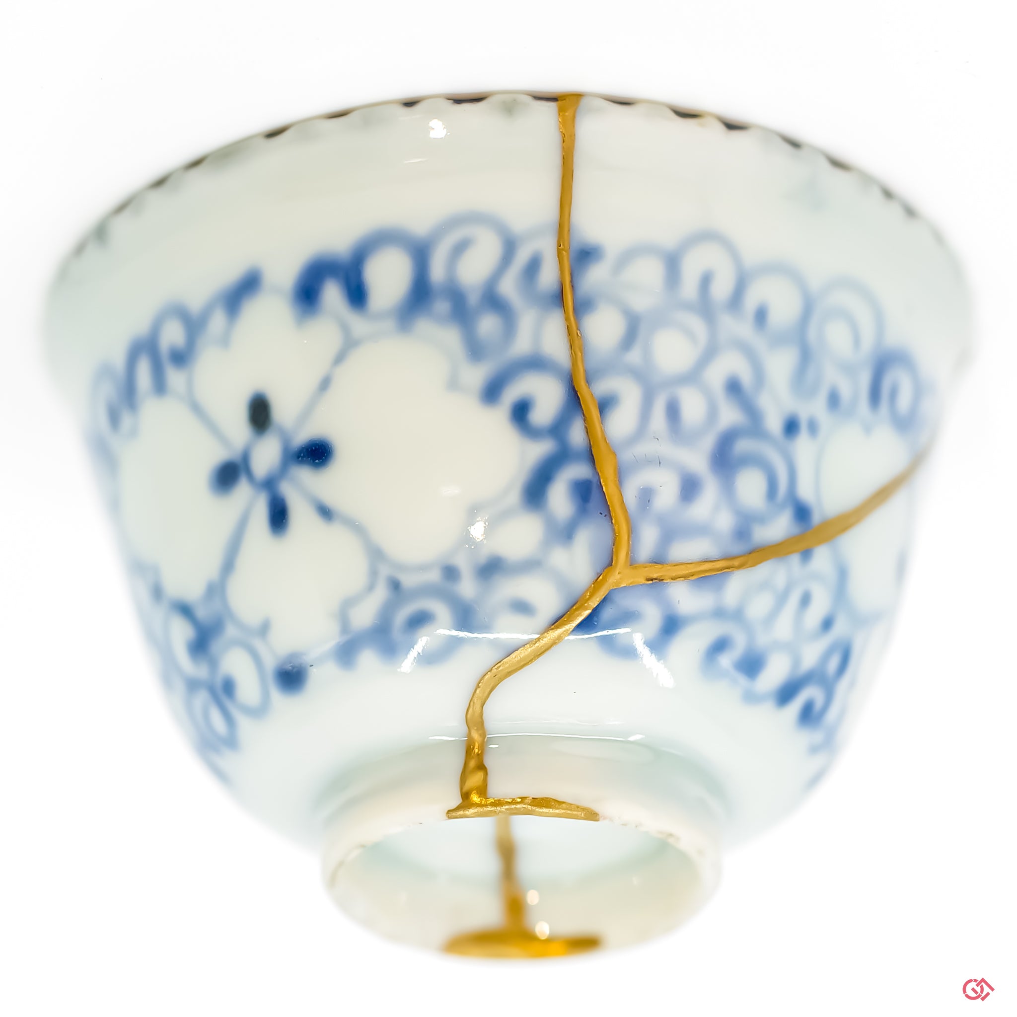 Close-up of 24k gold Kintsugi repair, showing the fine texture and seamless integration with the pottery.