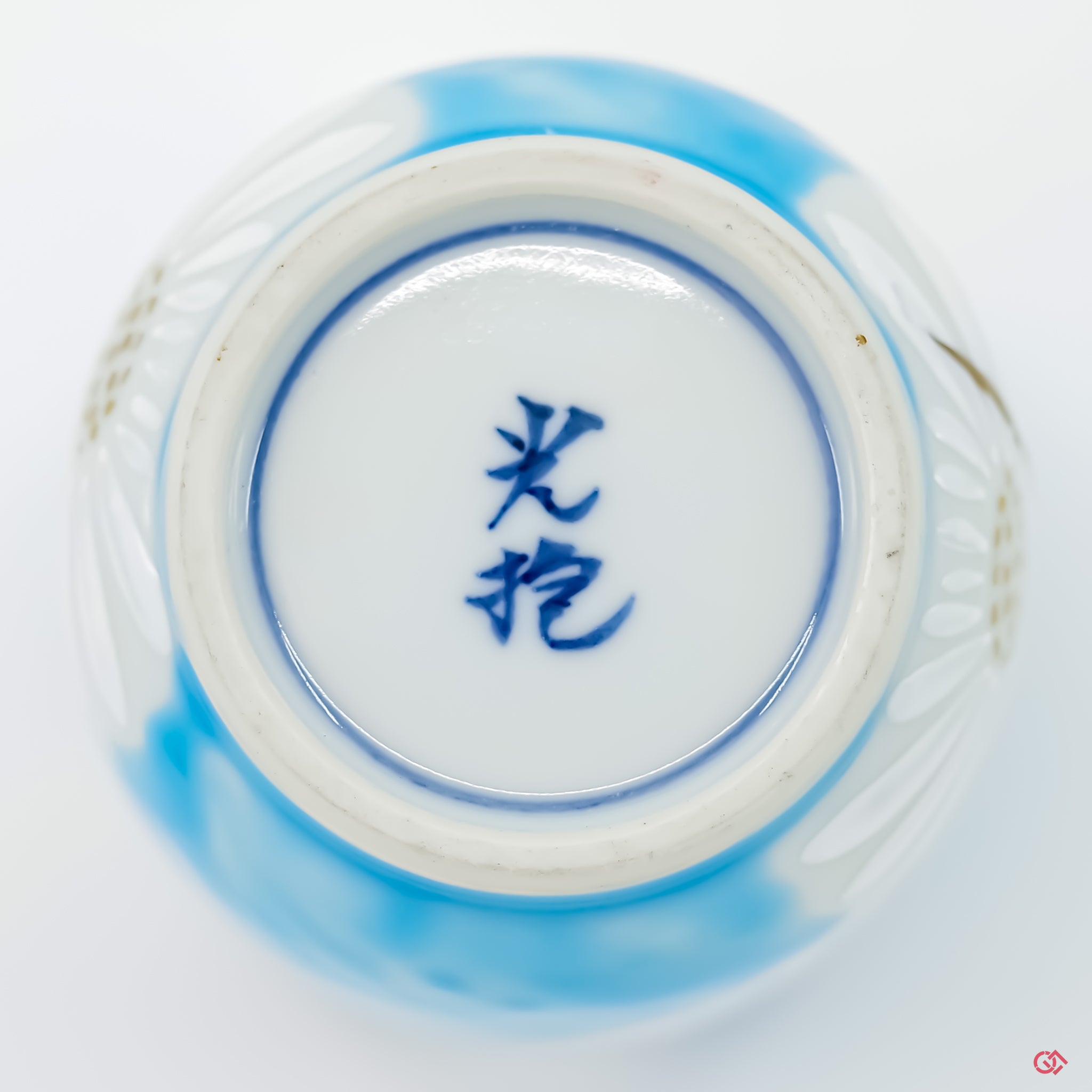 Explore the craftsmanship of Kintsugi: Bottom view of hand-repaired ceramic piece.