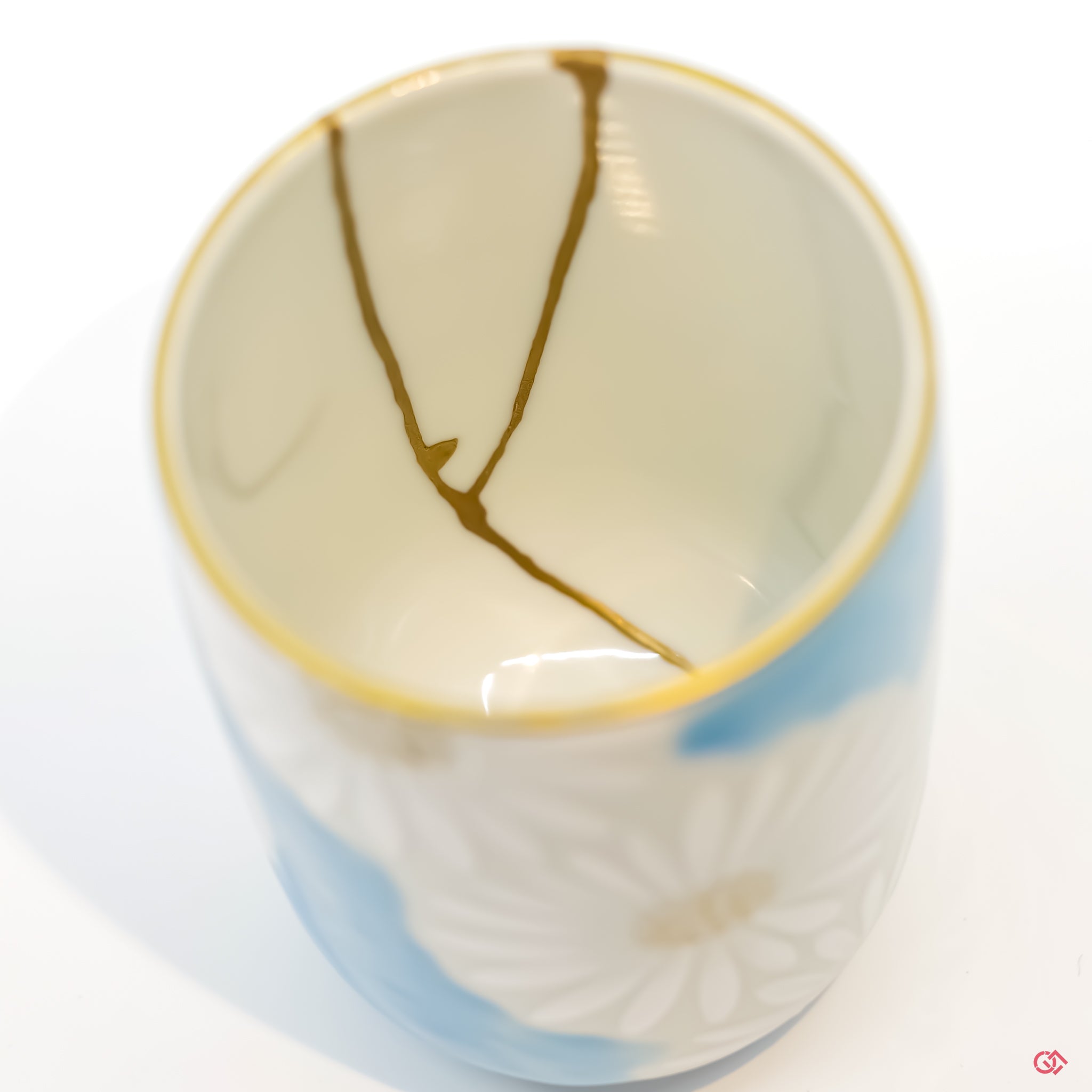 Detailed view of Kintsugi repair, showcasing craftsmanship and gold inlay.