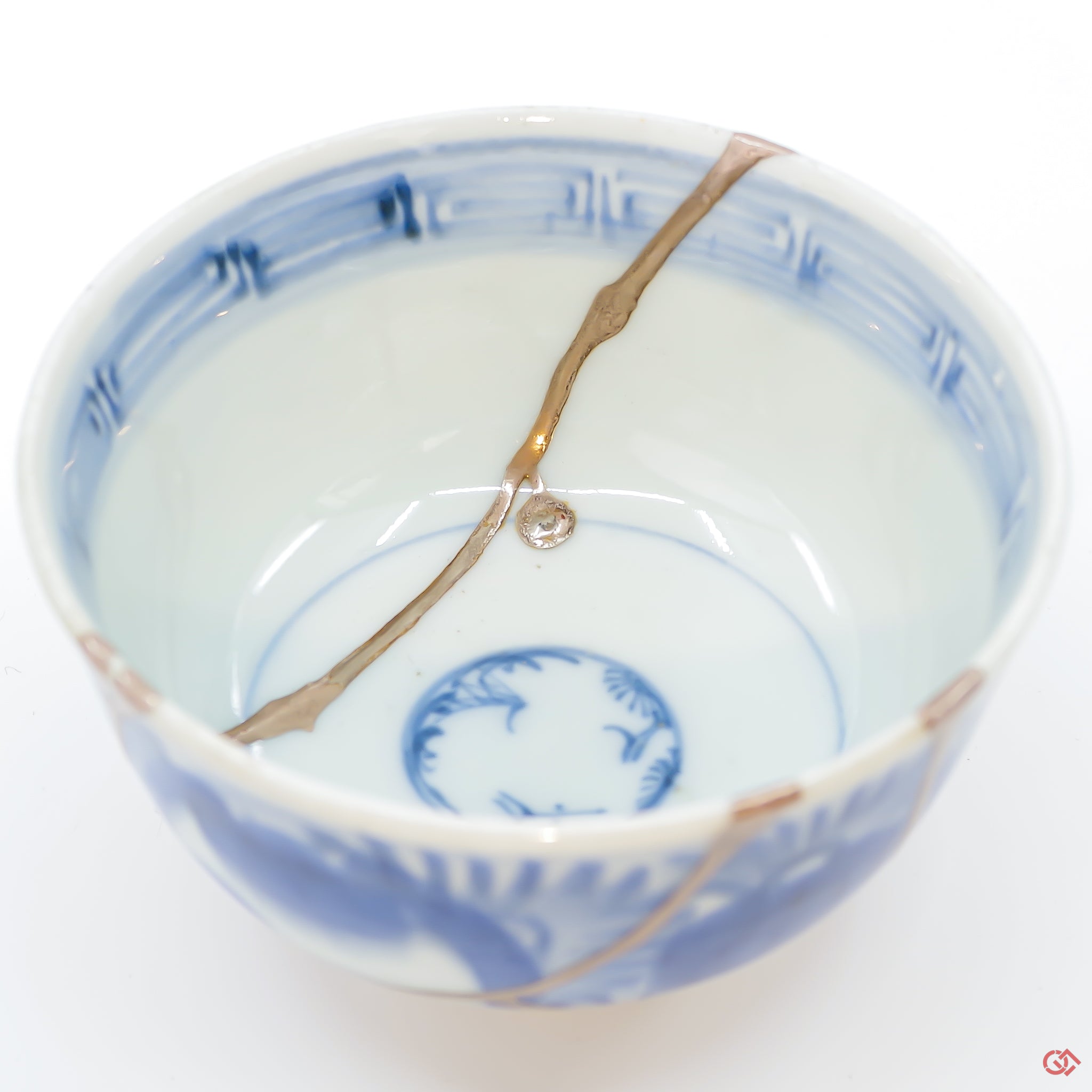 A close-up photo of an authentic Kintsugi pottery piece, showing the detail of its repairs and artisty. craftsmanship.
