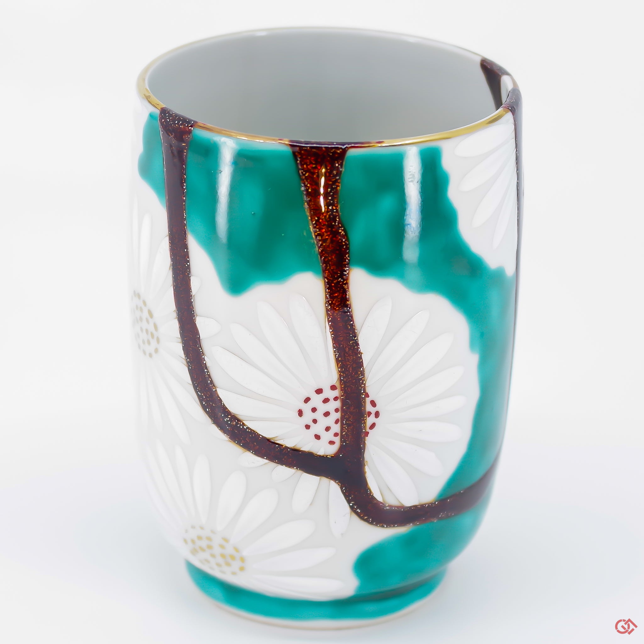 A close-up photo of an authentic Kintsugi pottery piece, showing the detail of its repairs and craftsmanship.